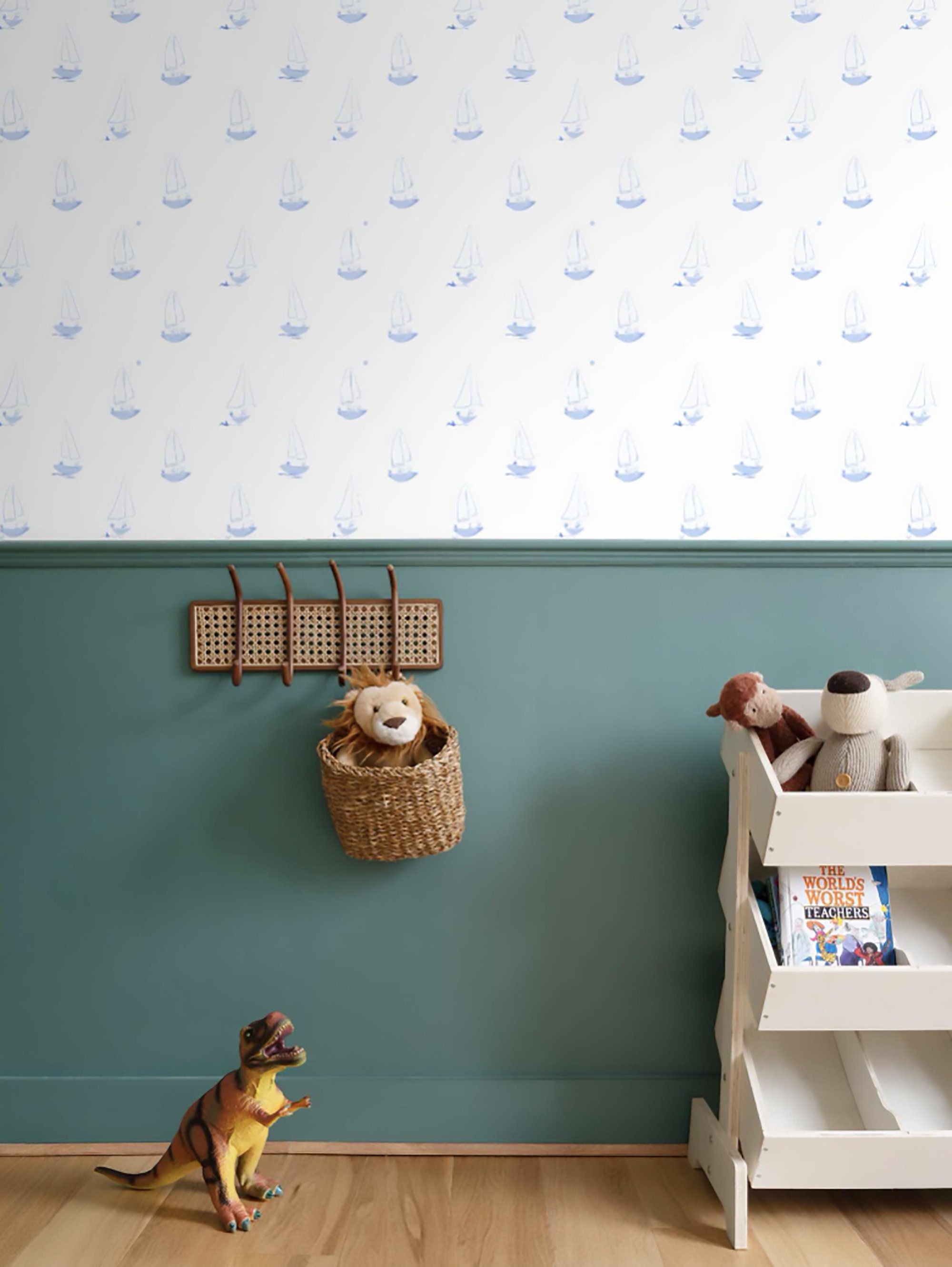 Peel and stick boy's room wallpaper featuring blue sailor dogs in sailboats.
