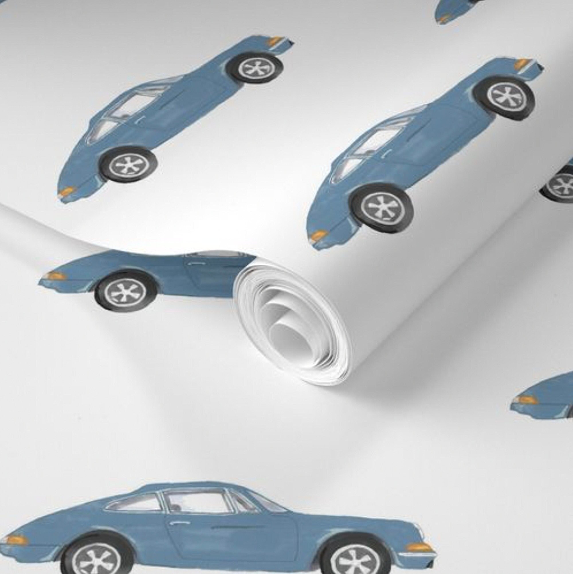 Close up of pre-pasted nursery wallpaper featuring navy Porsche 911.