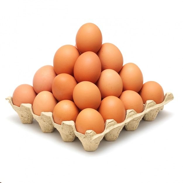 Premium Photo _ Pyramid of brown eggs isolated on white.jpg