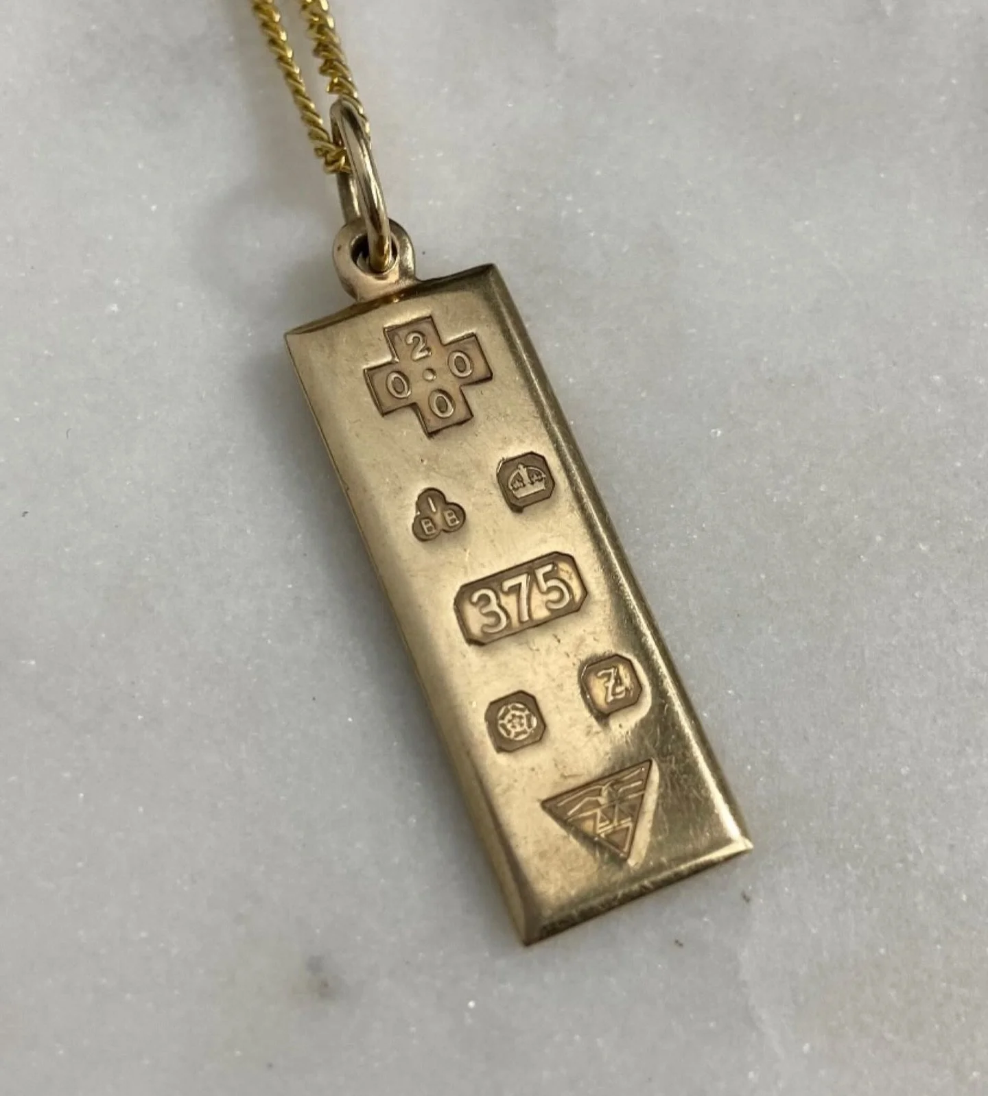 English 9K Millennium Ingot 

Officially stamped with English hallmarks, this 9K Millennium Ingot commemorates the turning of year 2000. Making it vintage at over 20 years old! The 375 represents the percentage of gold (37.5%) that make 9K! These ing