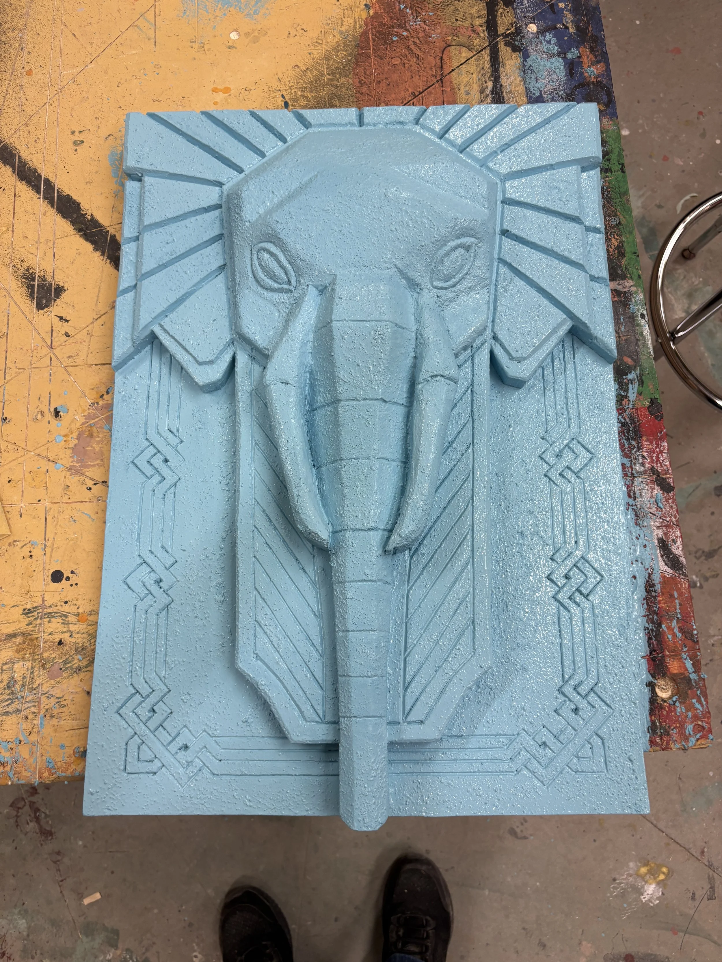 The sculpture painted and textured.