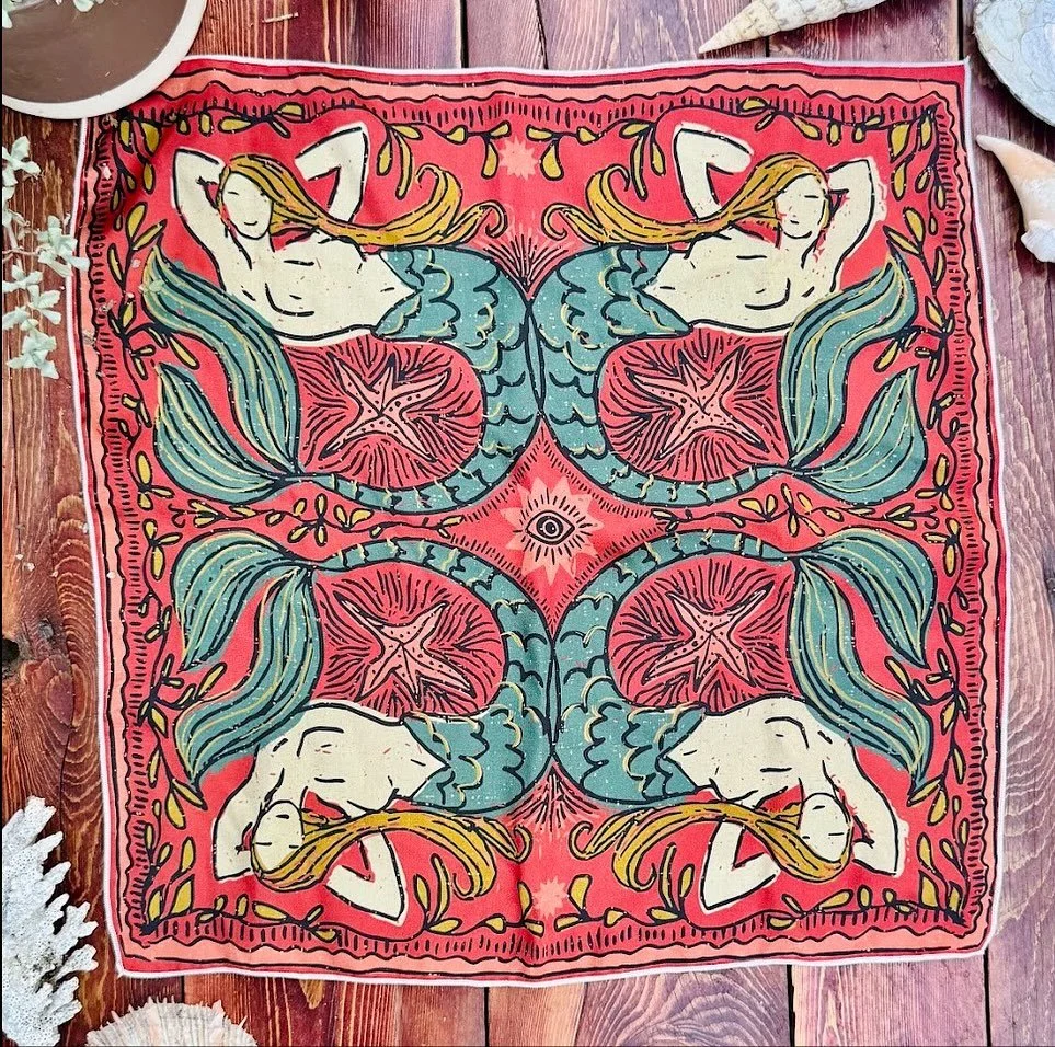 She&rsquo;s finally here 🧜&zwj;♀️
Hand-illustrated mermaids printed on pure silk &mdash; a love letter to the Pacific, inspired by Karolina Aphrodite, who loves mermaids.
Made to wear, share, or hang &mdash; however you decide to use your mermaid sc