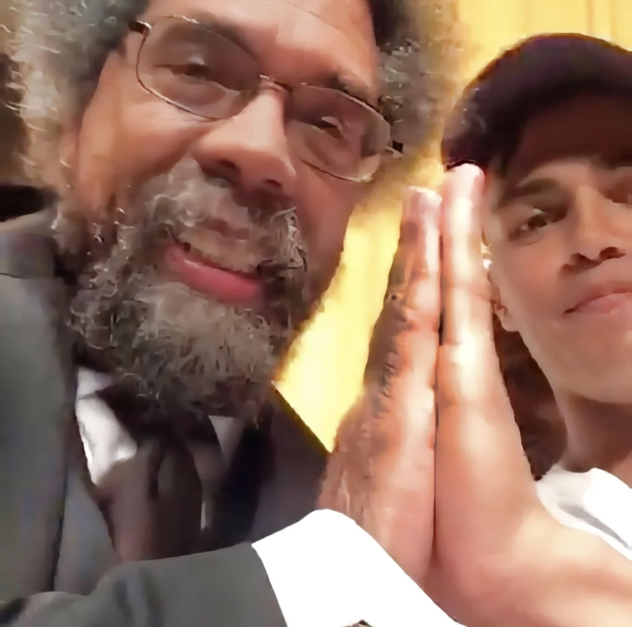 American philosopher Cornel West taking a selfie with Reconnect Founder Cliff Divine after physically uniting 300 people with the gesture
