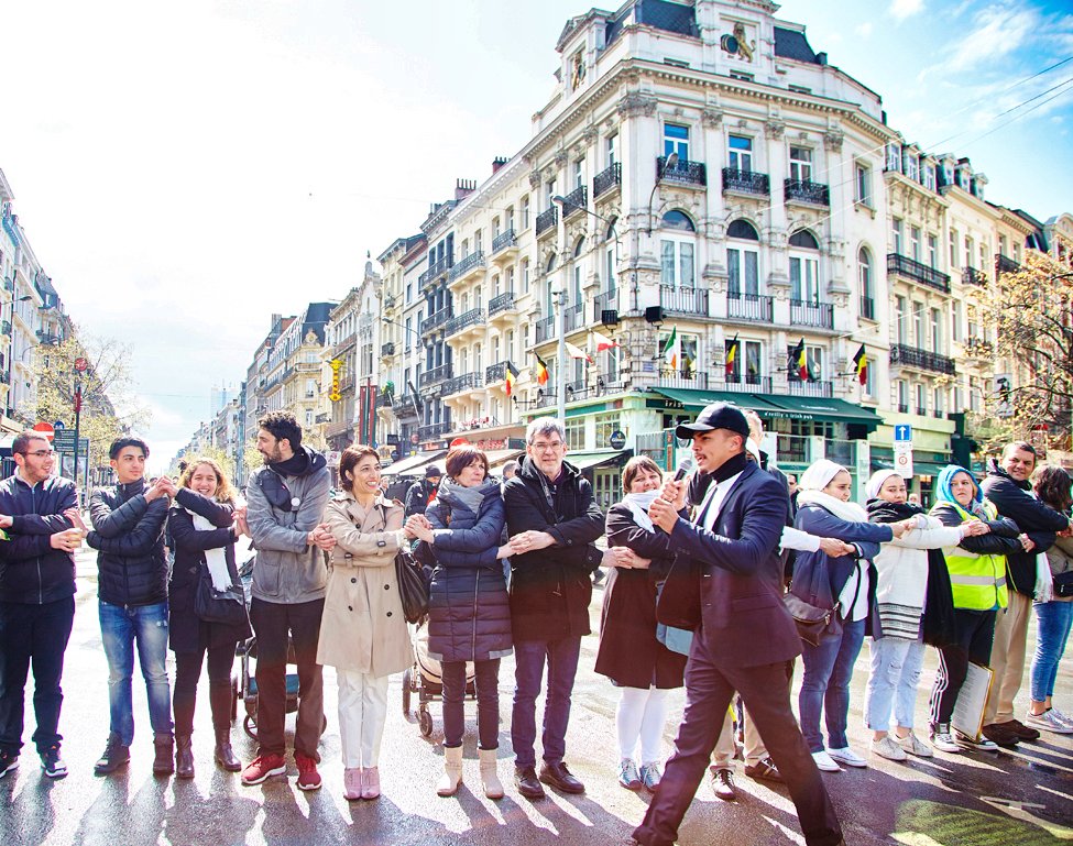 Cliff Divine leading a public tribute of more than 300 people in Brussels, Belgium, on April 24 2016, following the airport and metro bombings that claimed 32 lives. The gathering formed part of the early #Connect peace movement, promoting human conn