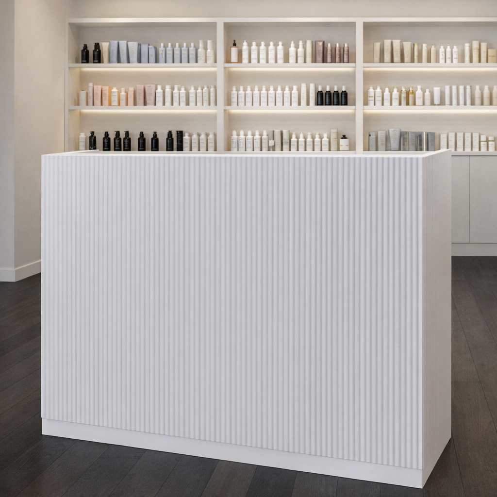 Display of skincare or cosmetic products on shelves behind a white counter in a modern store.