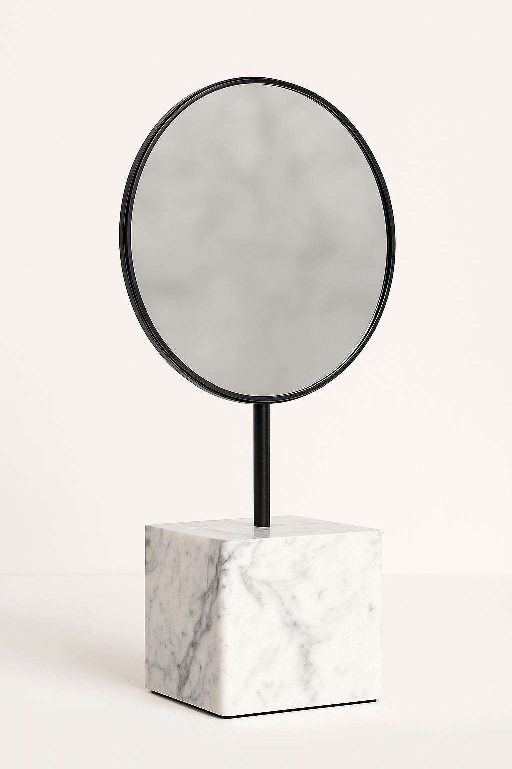 Round mirror with black frame on a black stand, mounted on a square white marble base