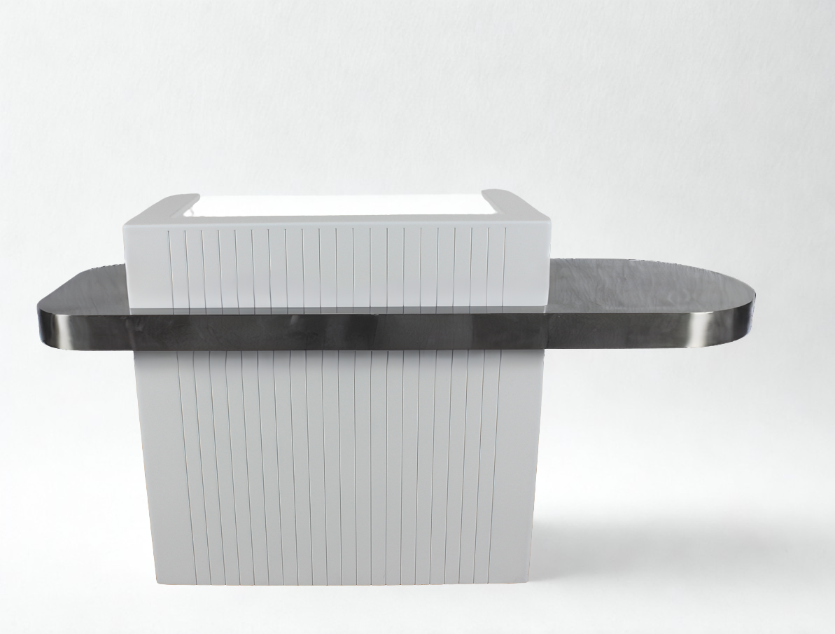 A white reception desk with a stainless steel feature around the outside.