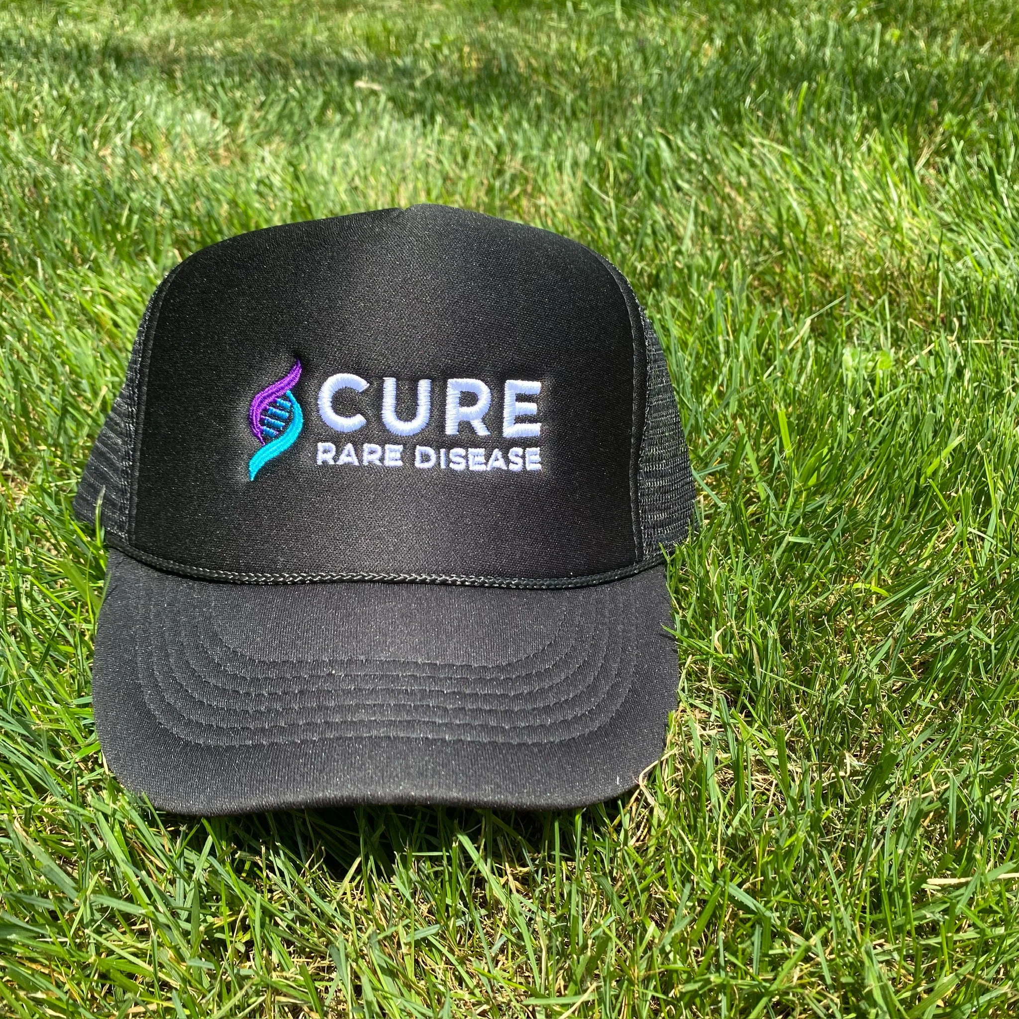 Cure Rare Disease black cap on grass