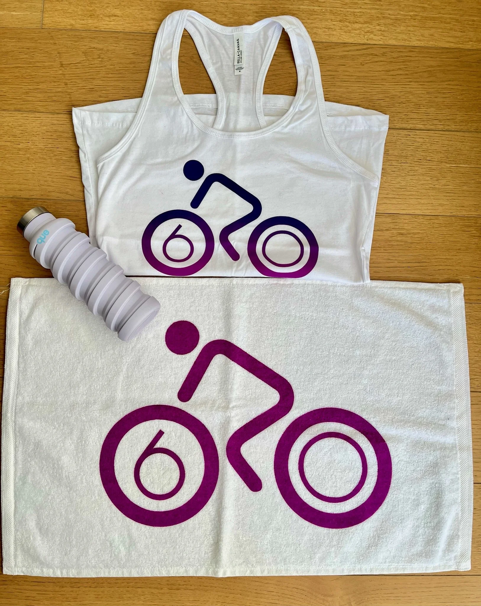 Cycling tank top, towel, and water bottle with bike design