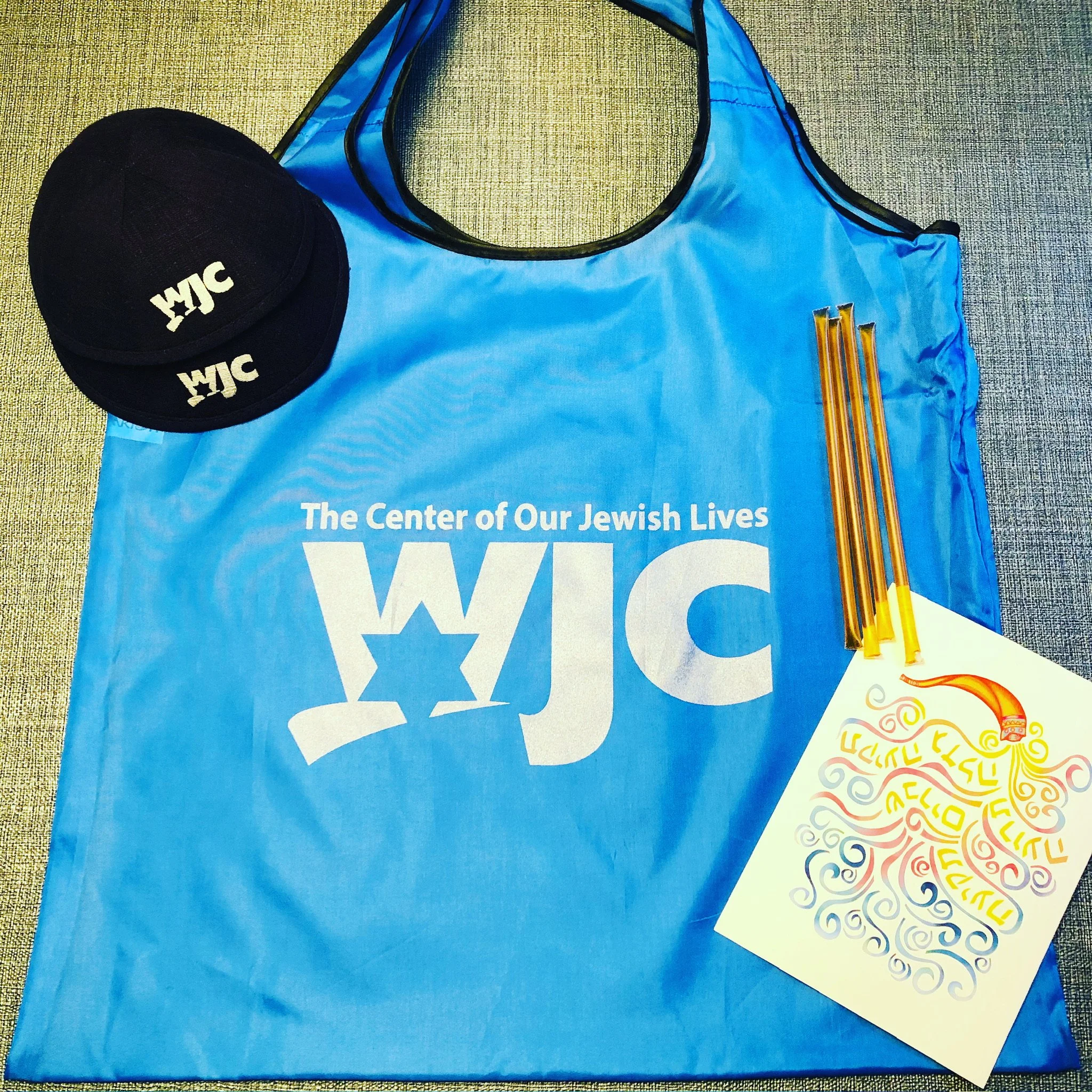 Blue WJC tote bag with matching cap and pencils