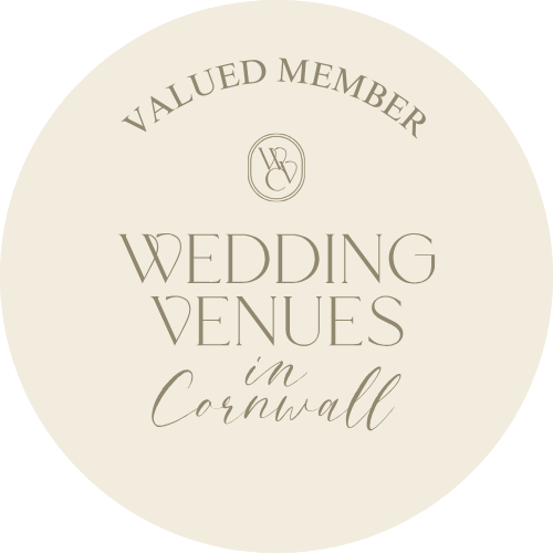 A circular logo for Valued Member Wedding Venues in Cornwall with elegant text and a monogram at the top.