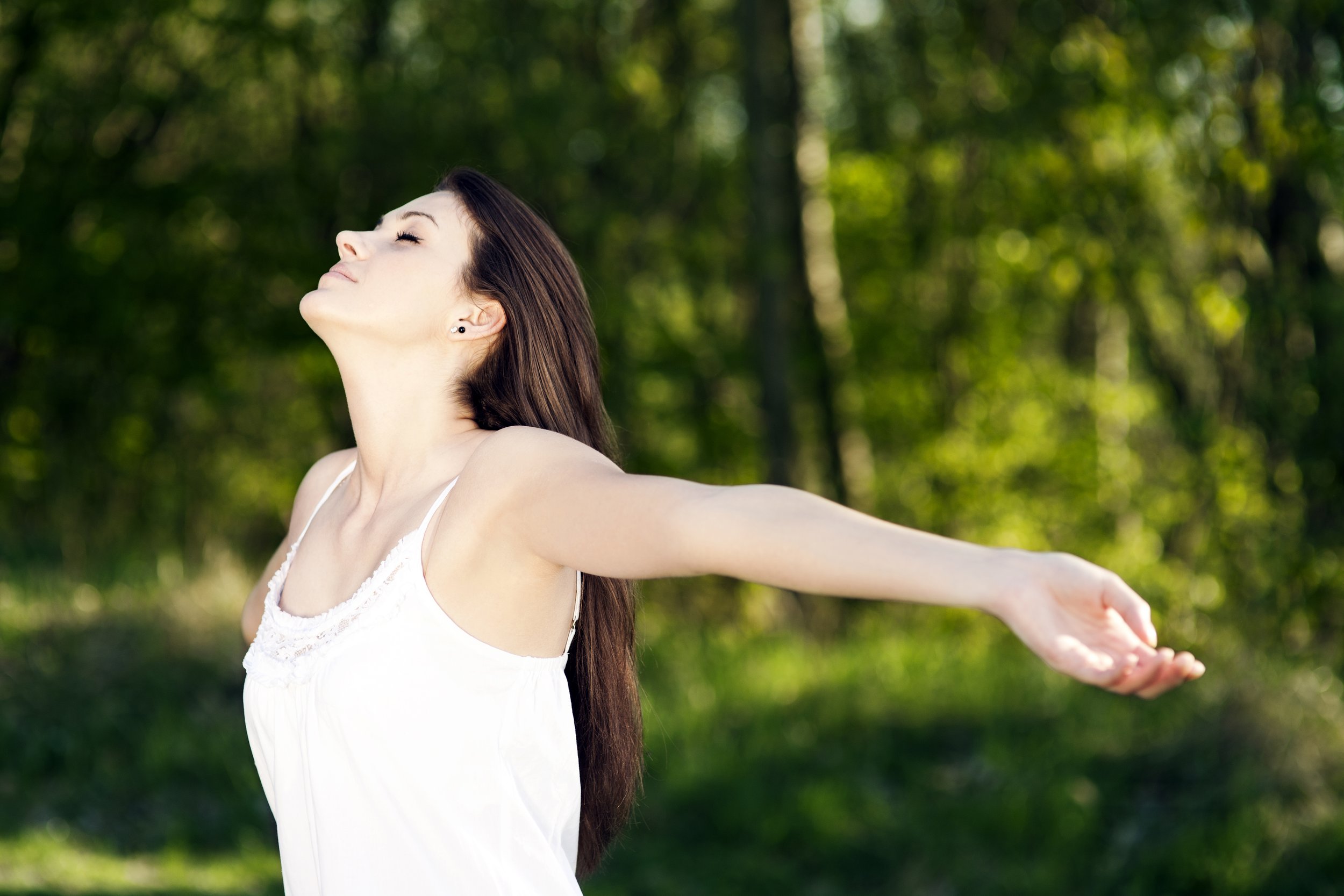 Freepik-young-woman-enjoying-summer-park.jpg
