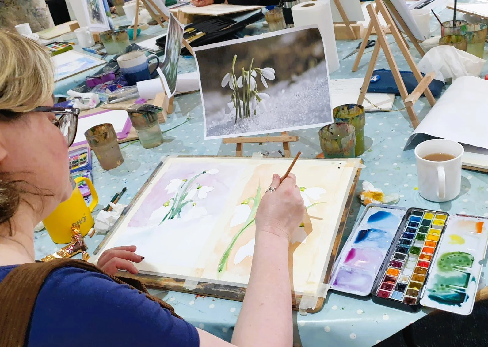 Student painting flowers.jpeg