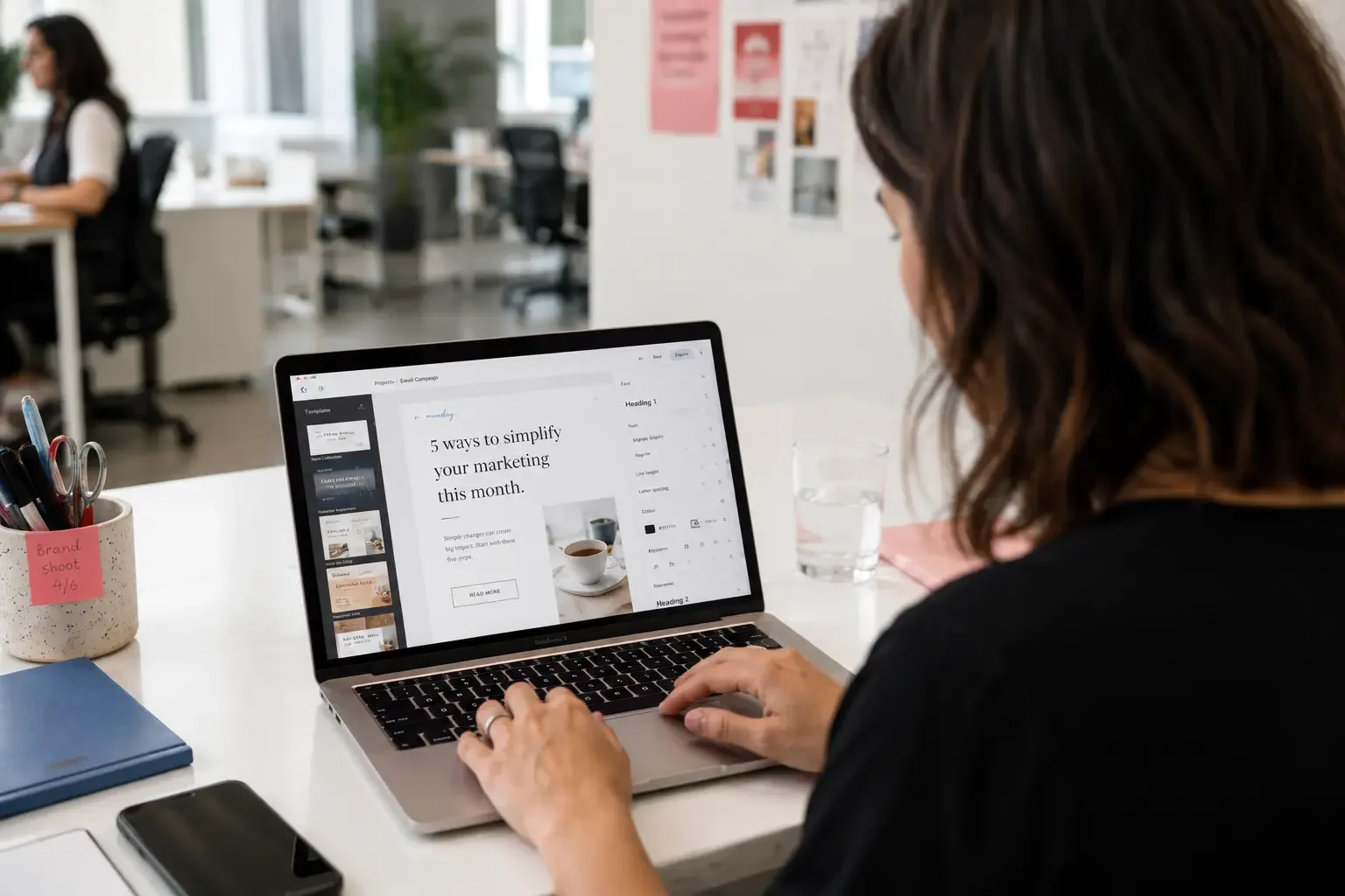 A small business owner managing email marketing at a laptop.