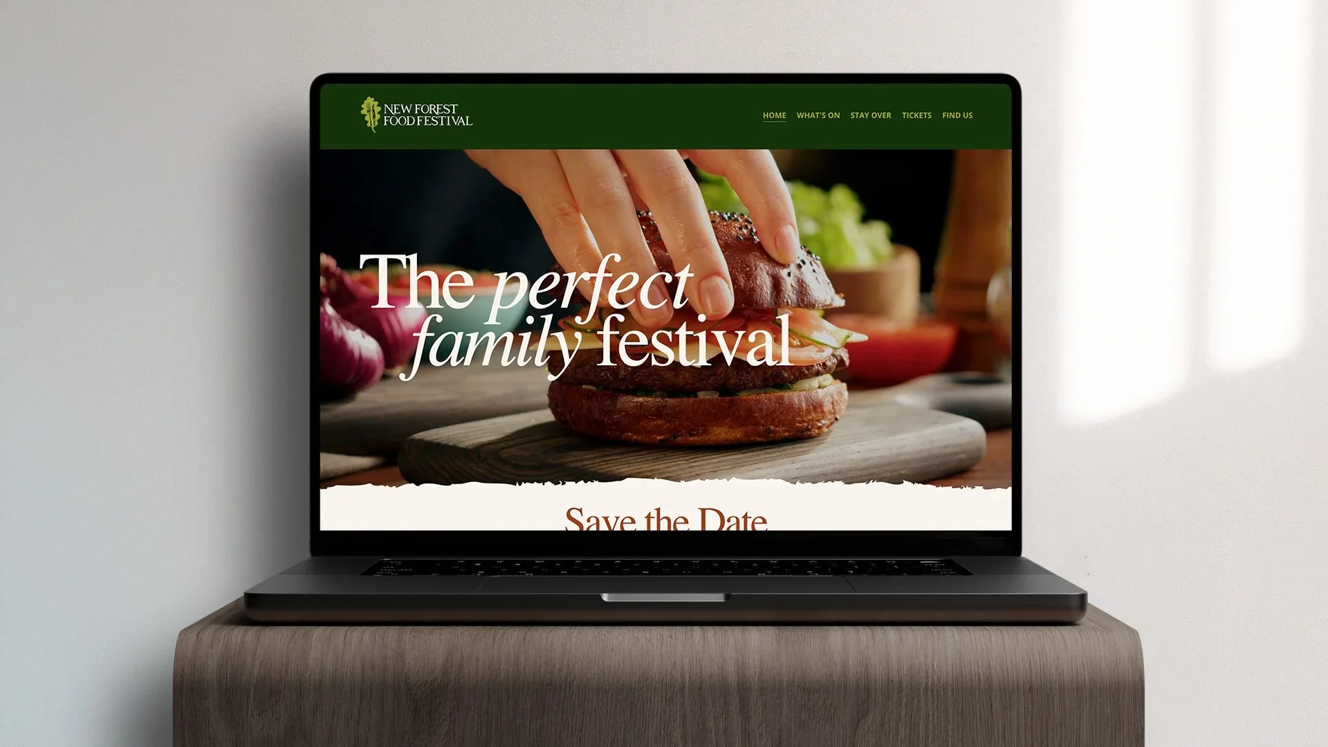 new forest food festival website layout laptop designed by saia creative
