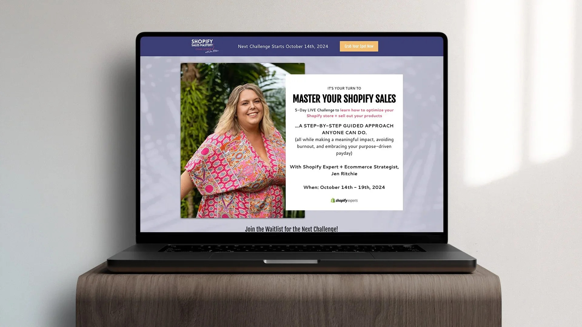 Laptop displaying a promotional webpage for a Shopify sales mastery challenge, featuring a smiling woman, green foliage background, and event details for October 14th-19th, 2024.