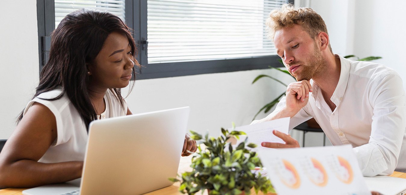 Founder working with fractional CMO discussing marketing strategy and growth plan.