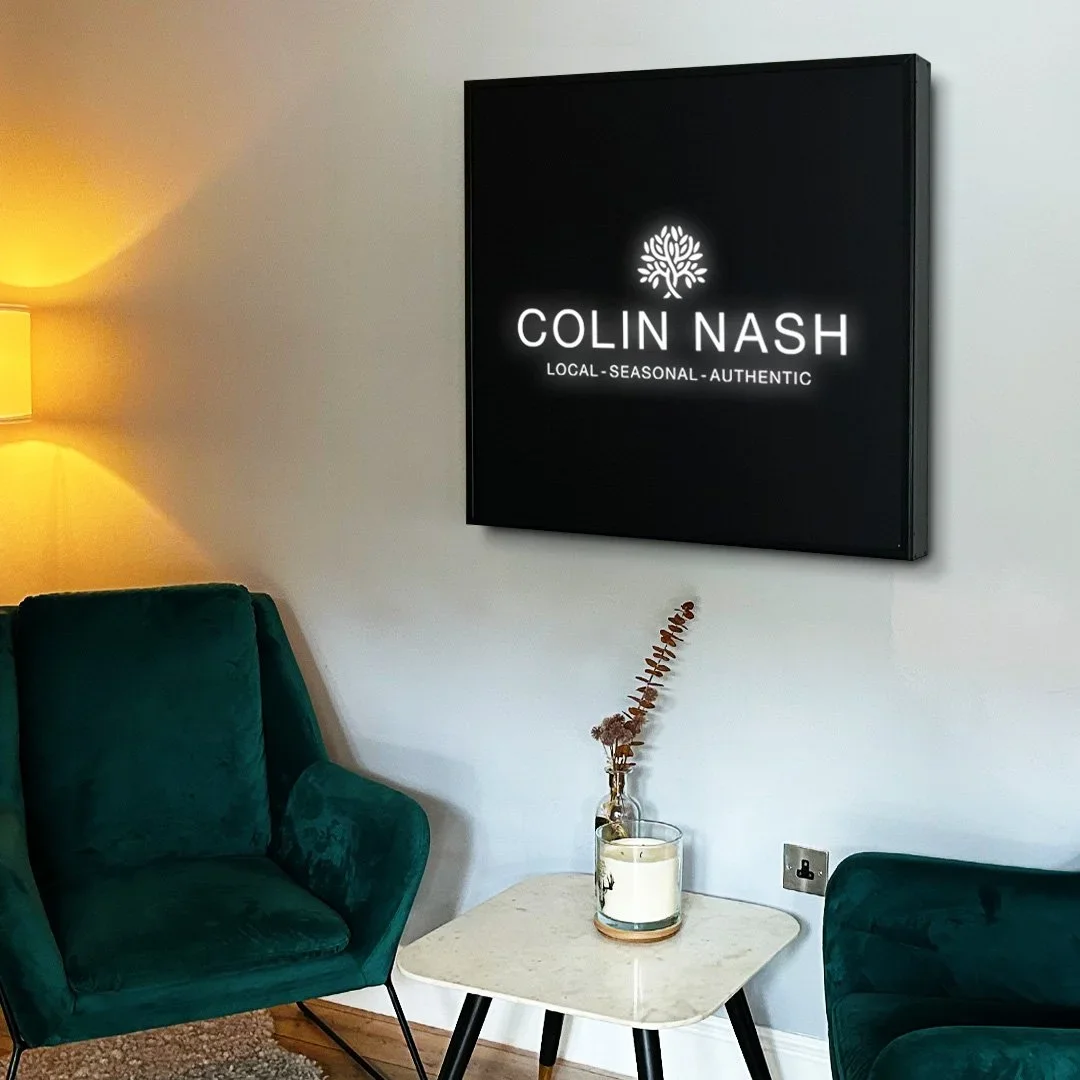 colin nash illuminated metal logo sign designed by saia creative