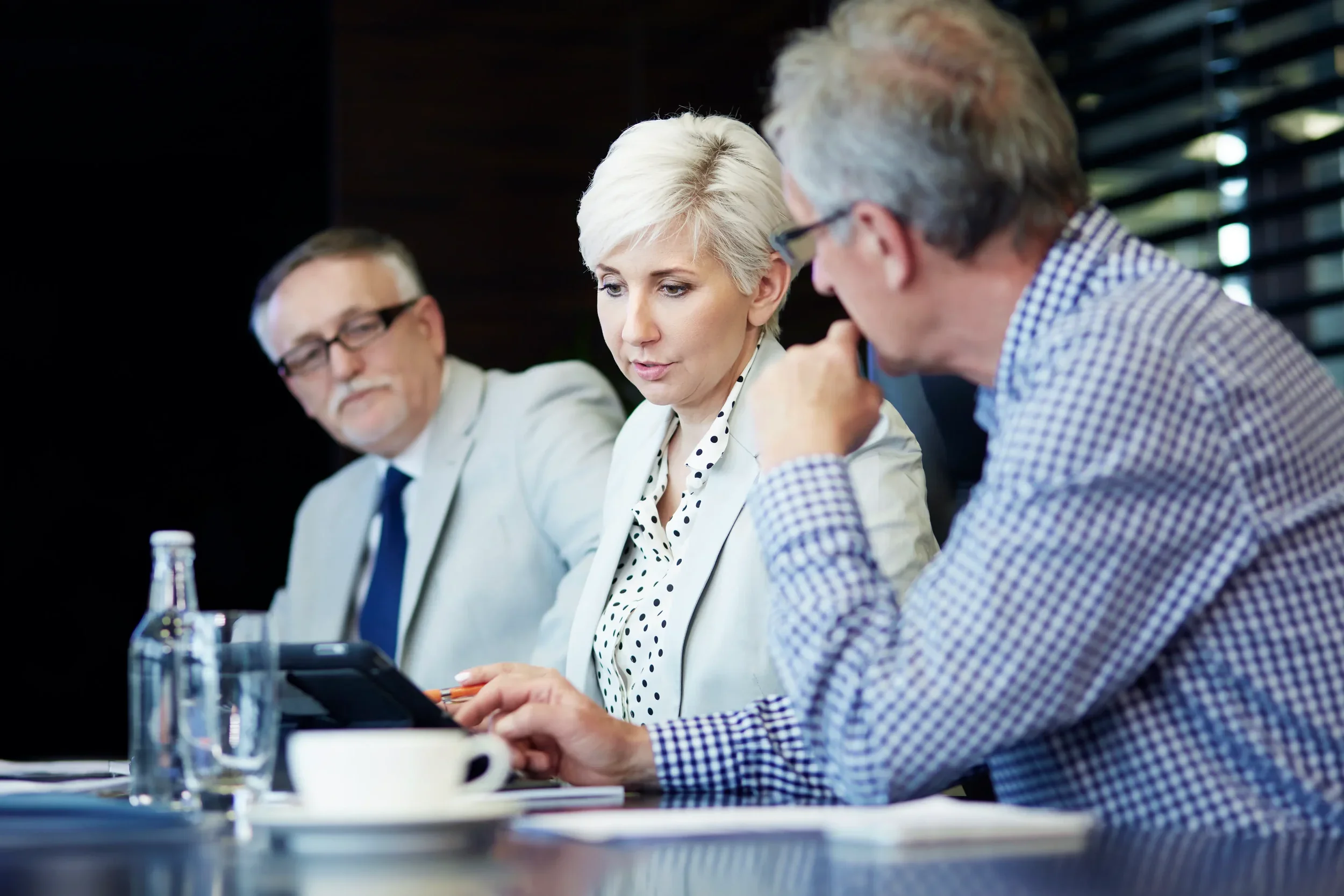 An editorial-style human-focused image showing senior business leaders in discussion or decision-making, representing clarity, judgement and leadership in B2B marketing for 2026.
