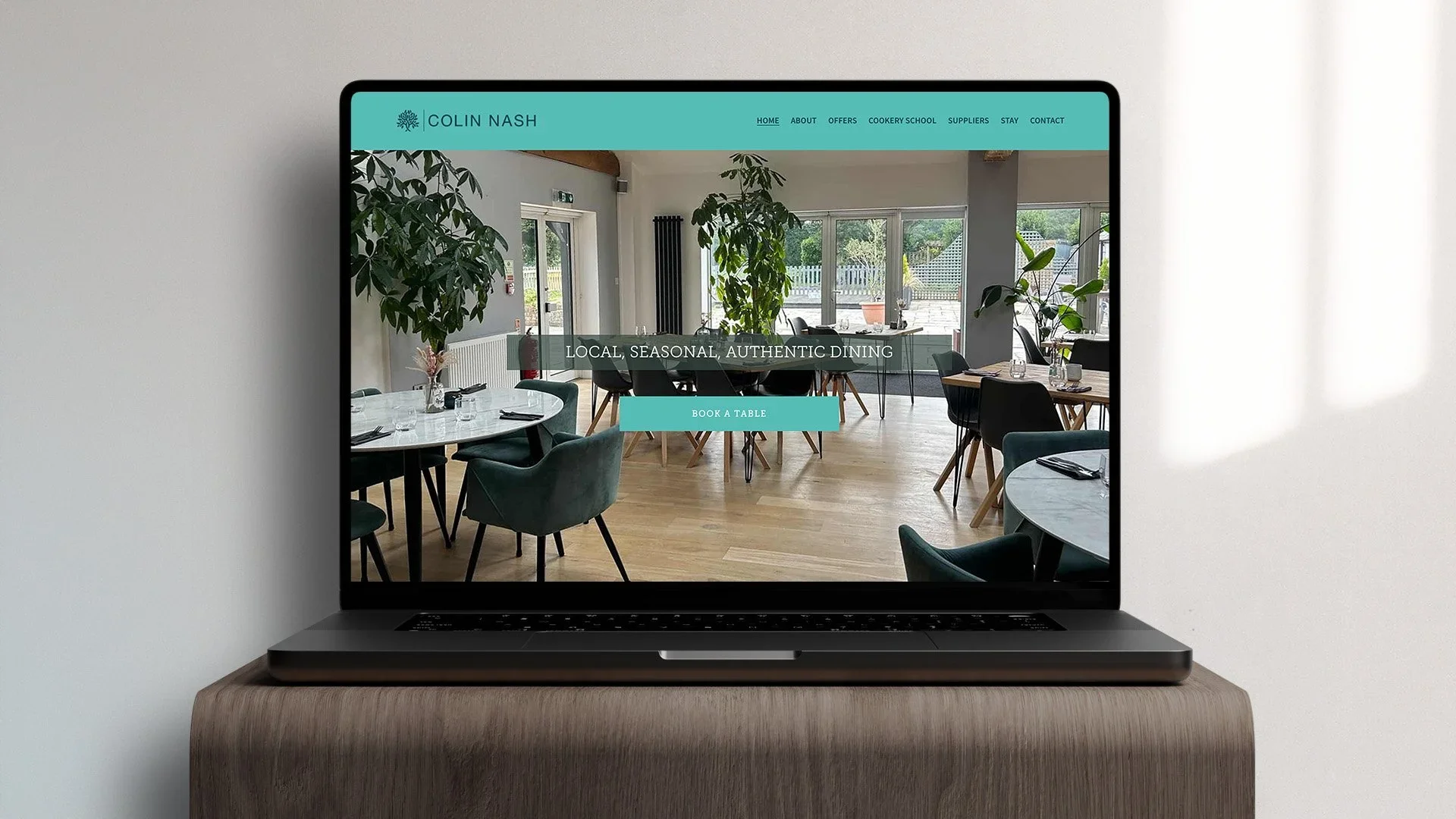 colin nash website laptop layout designed by saia creative