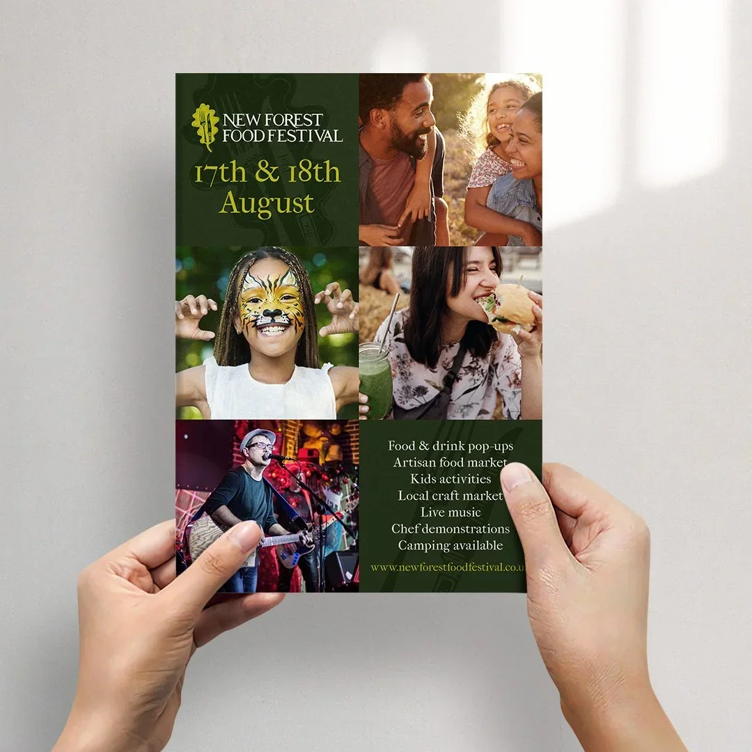 hands holding new forest food festival marketing flyer designed by saia creative