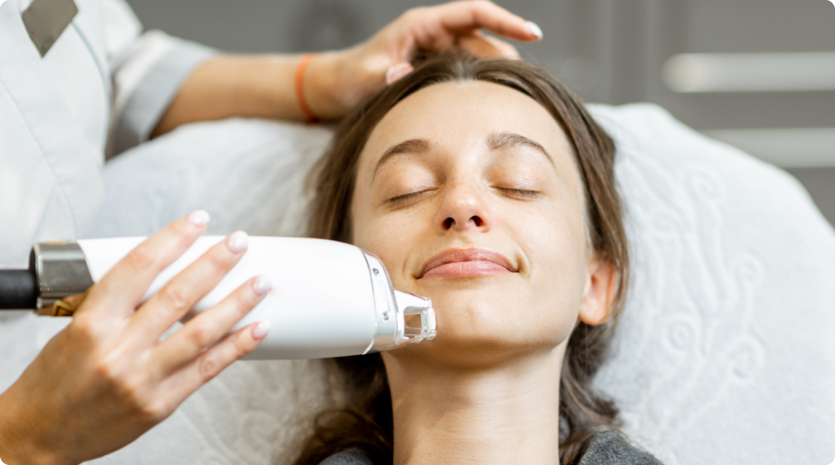 Cosmetic dermatology treatment applied to facial skin in a clinic