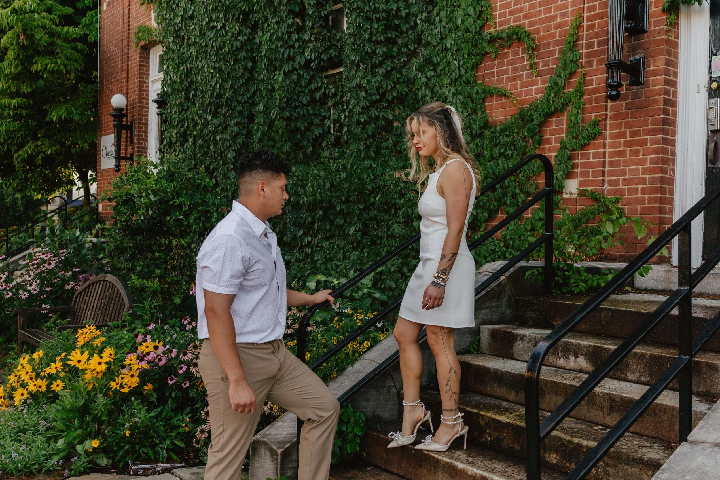 Timeless engagement proposal photos in downtown Fayetteville, AR Rayli Rose Photography 