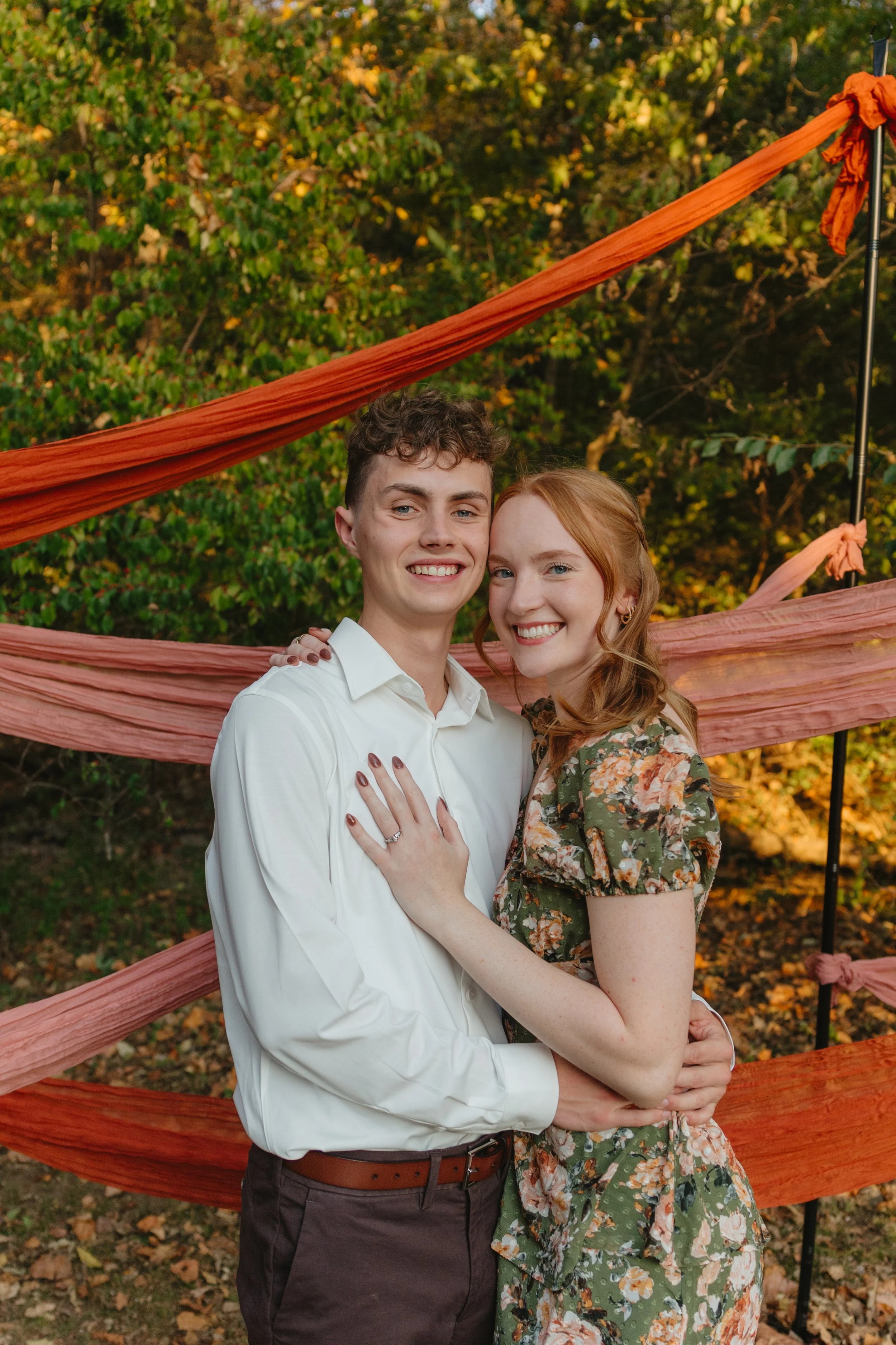 NWA wedTimeless engagement proposal photos in downtown Fayetteville, AR Rayli Rose Photography ding photographer