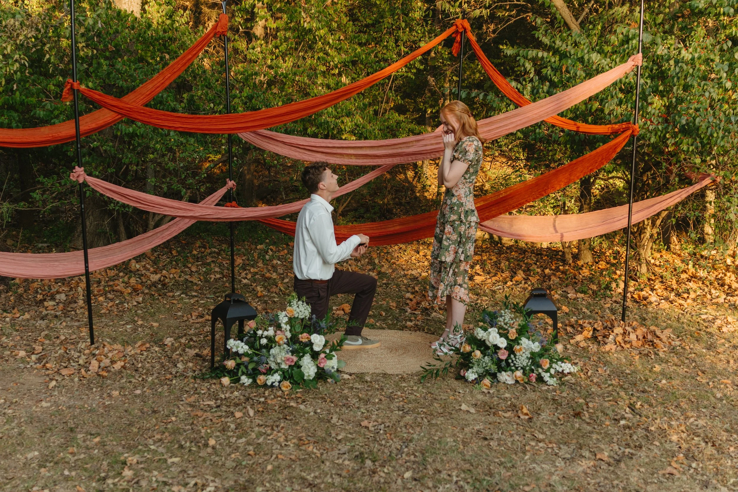Timeless engagement proposal photos in downtown Fayetteville, AR Rayli Rose Photography 