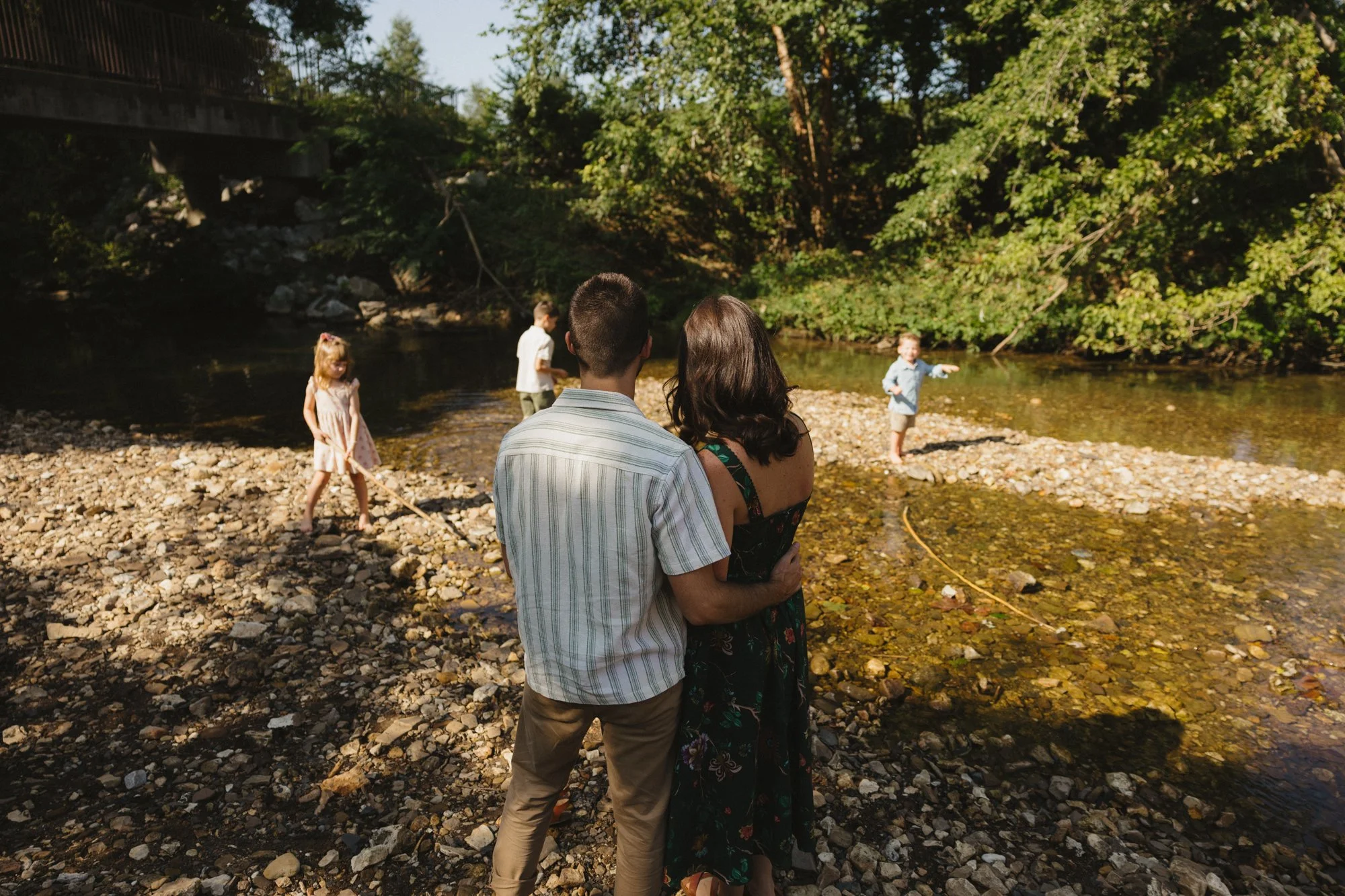 creek family photos with kids playing in a local Fayetteville Bentonville creek photos