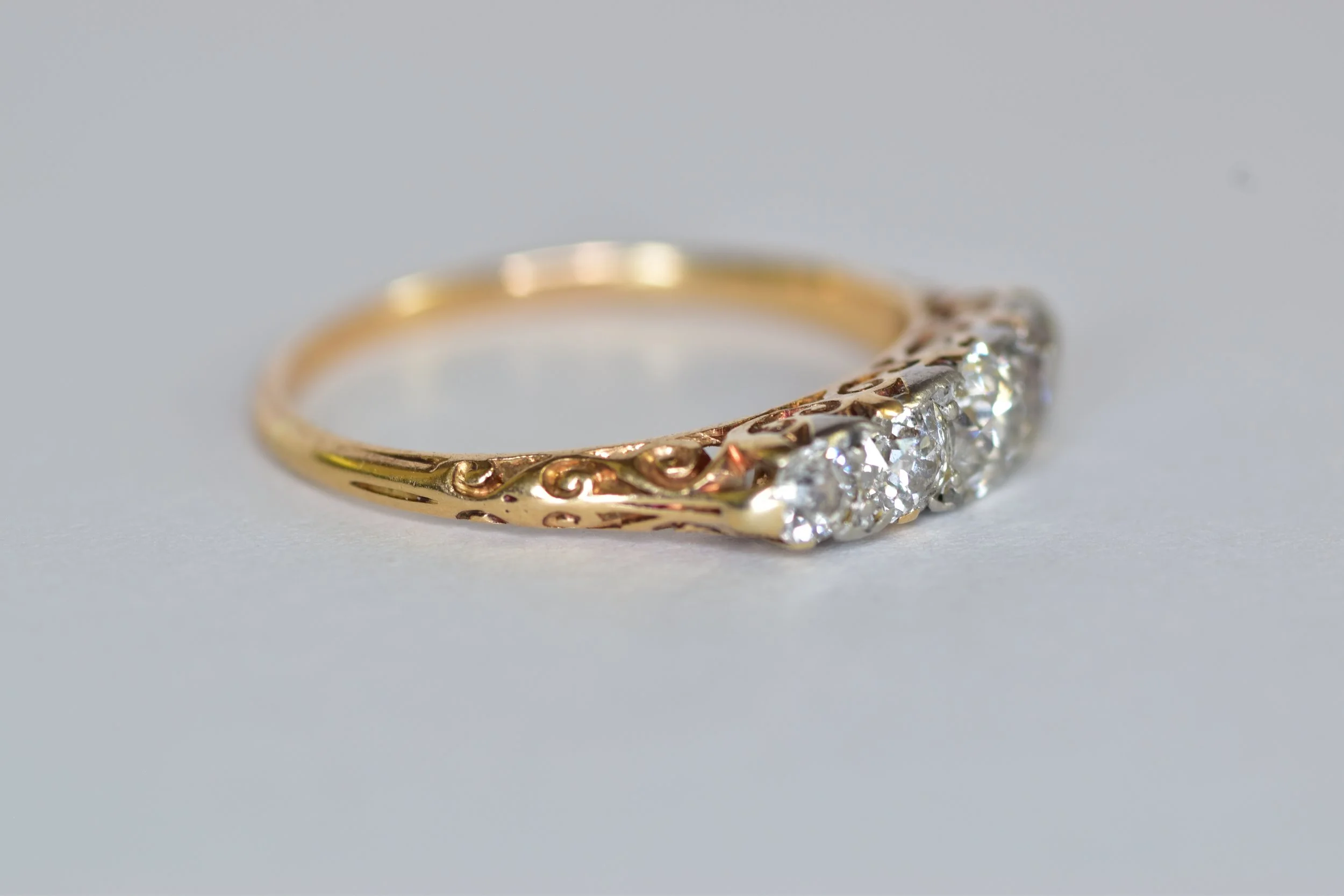 Antique Edwardian European-cut diamond band ring in gold and platinum