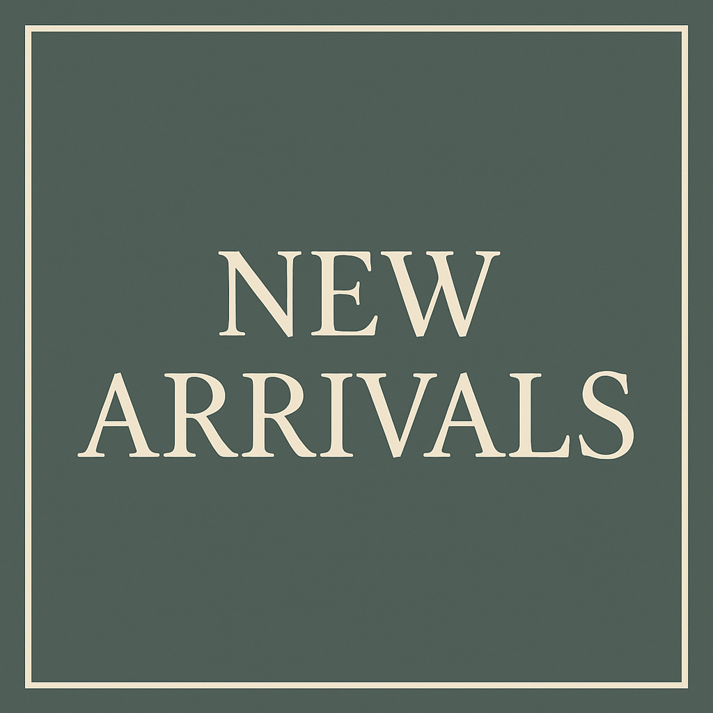 Signboard with the text 'New Arrivals' in white letters on a dark green background.
