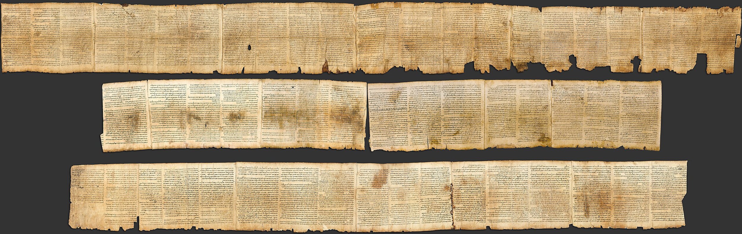 A very long, laid out scroll that contains almost the entirety of the Book of Isaiah.