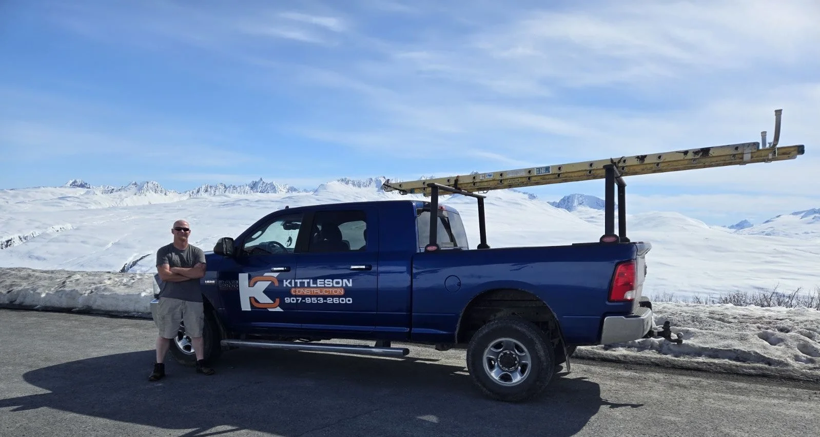 Jessie Kittleson Construction with company truck in alaska