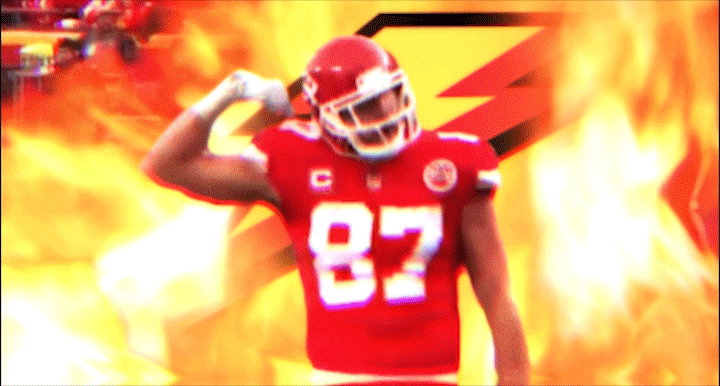 A football player in a red uniform with the number 87, wearing a helmet, poses with a fist near his head. The background is fiery with flames and a lightning bolt.