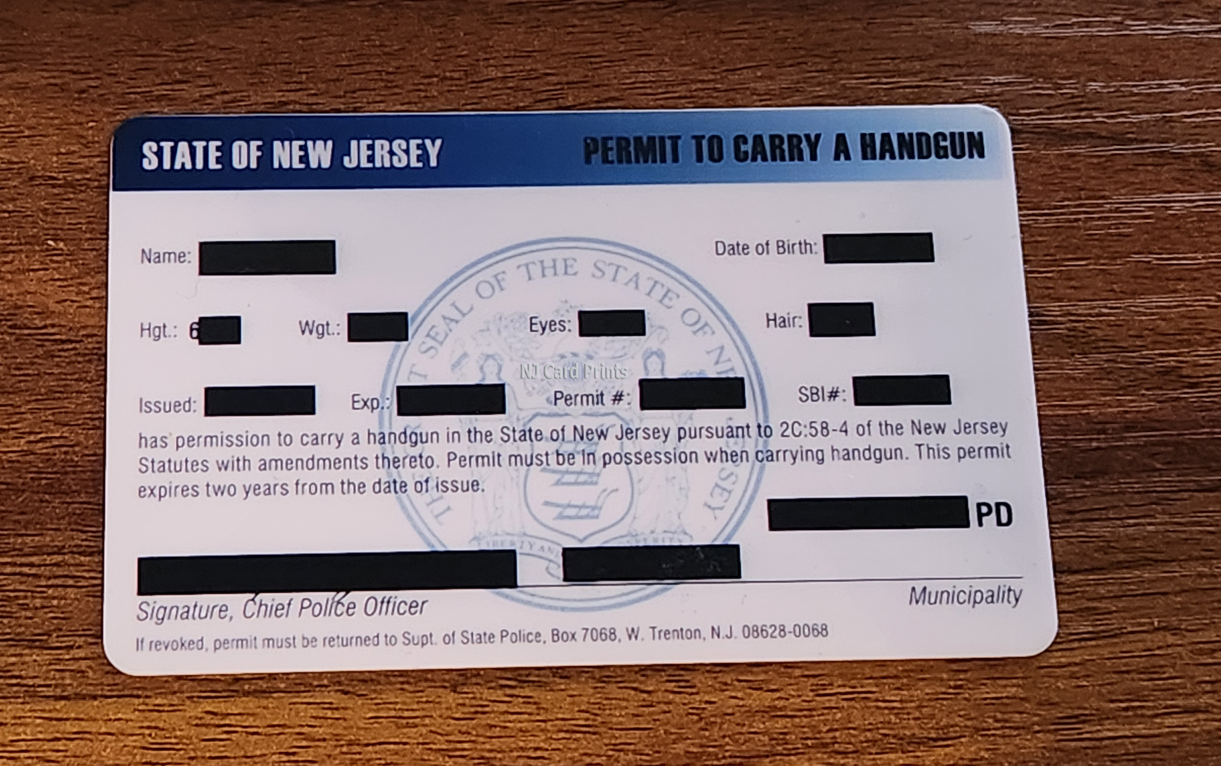 New Jersey state permit to carry a handgun card, featuring State Seal of New Jersey watermark.