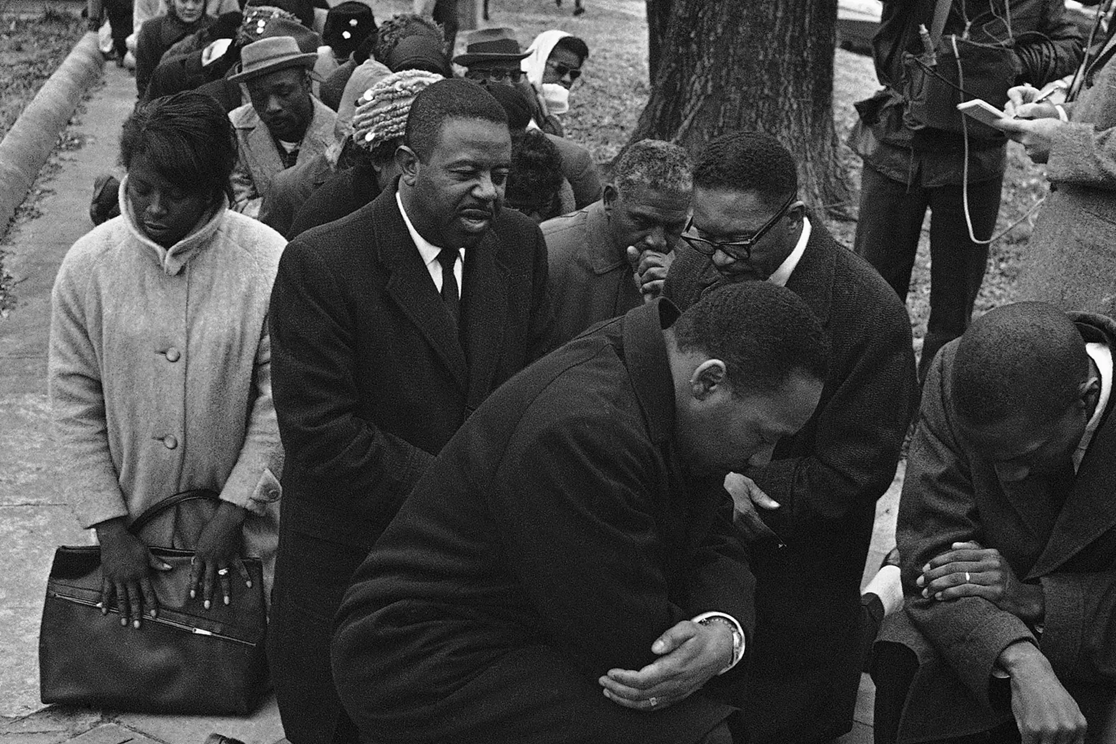 Dr. Martin Luther King Jr., center, leads civil rights protesters in prayer on Feb. 1, 1965 in Selma, Alabama after they were arrested for marching to the Dallas County courthouse as part of a voter registration drive. BH—AP Photo
