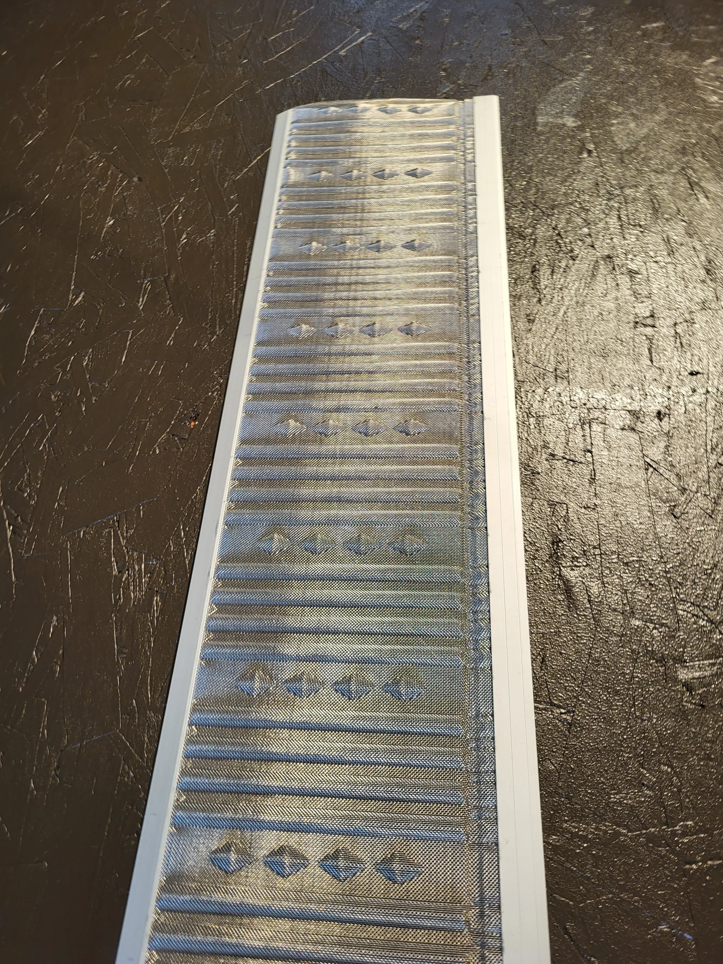 A micro mesh stainless steel gutter hood