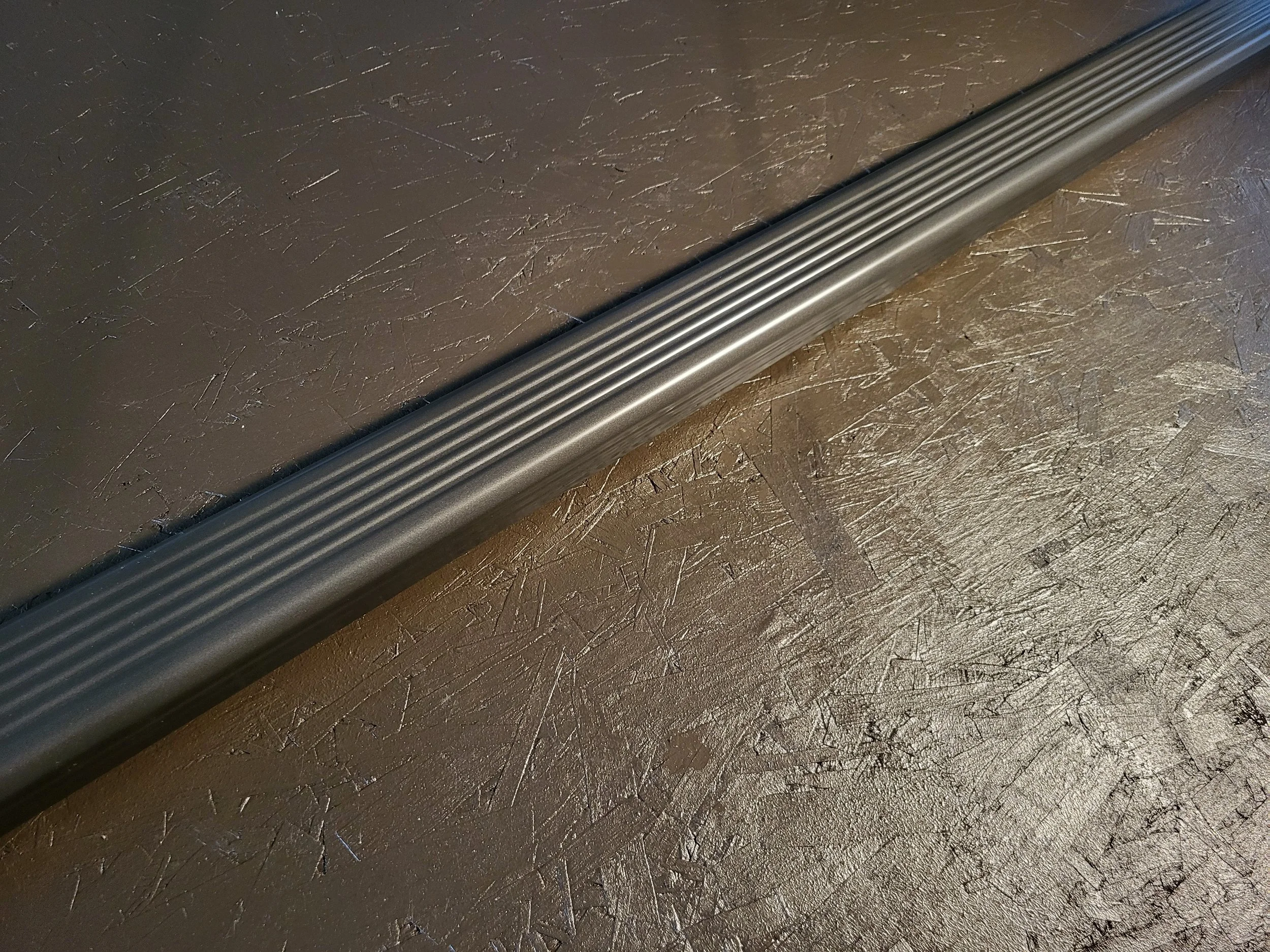 Close-up of a 2x3 inch corrugated aluminum downspout