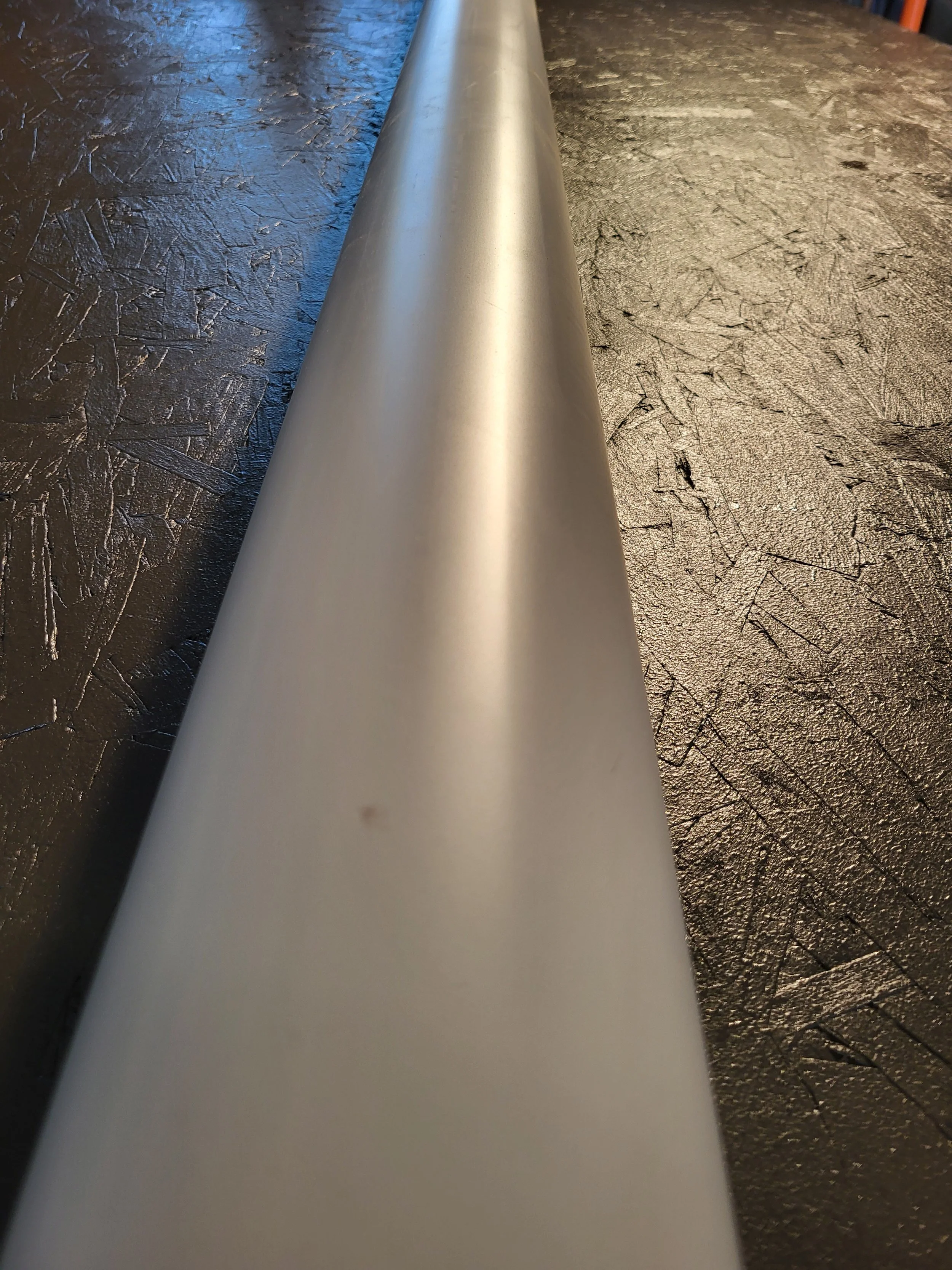 Close-up of an aluminum 4 inch round downspout