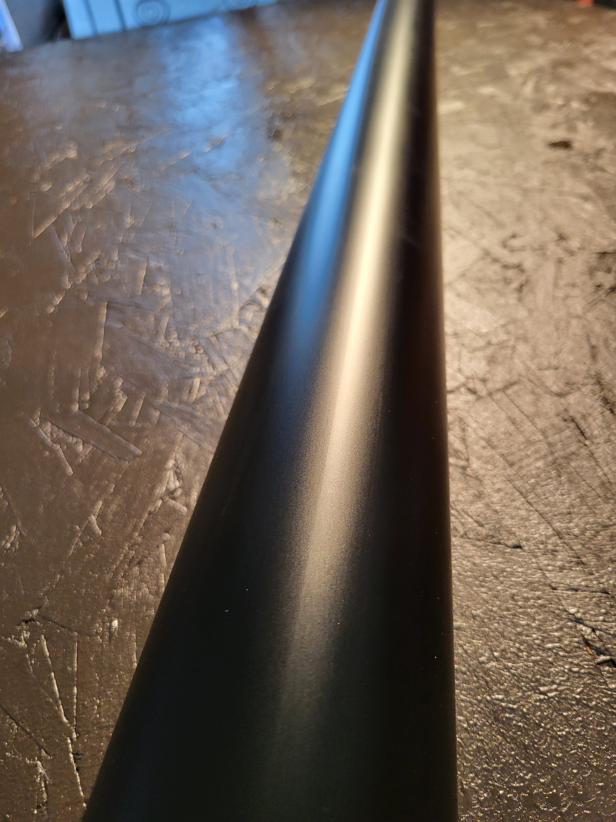 Close-up of a black round downspout.
