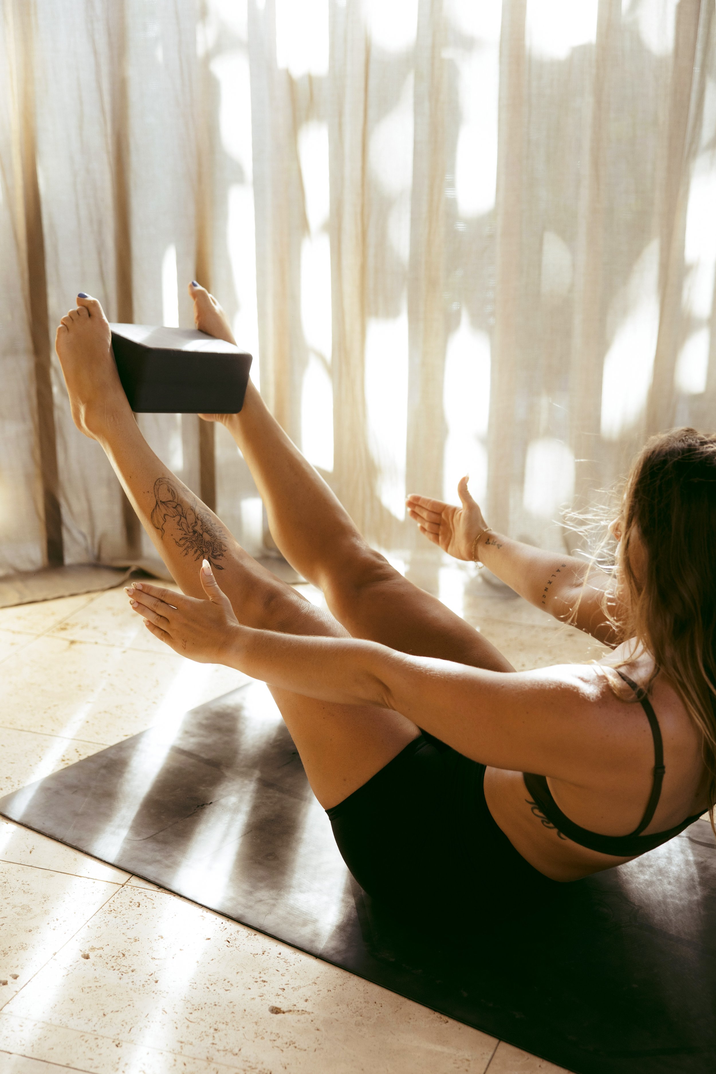 Fit woman holding a plank during a core pilates workout