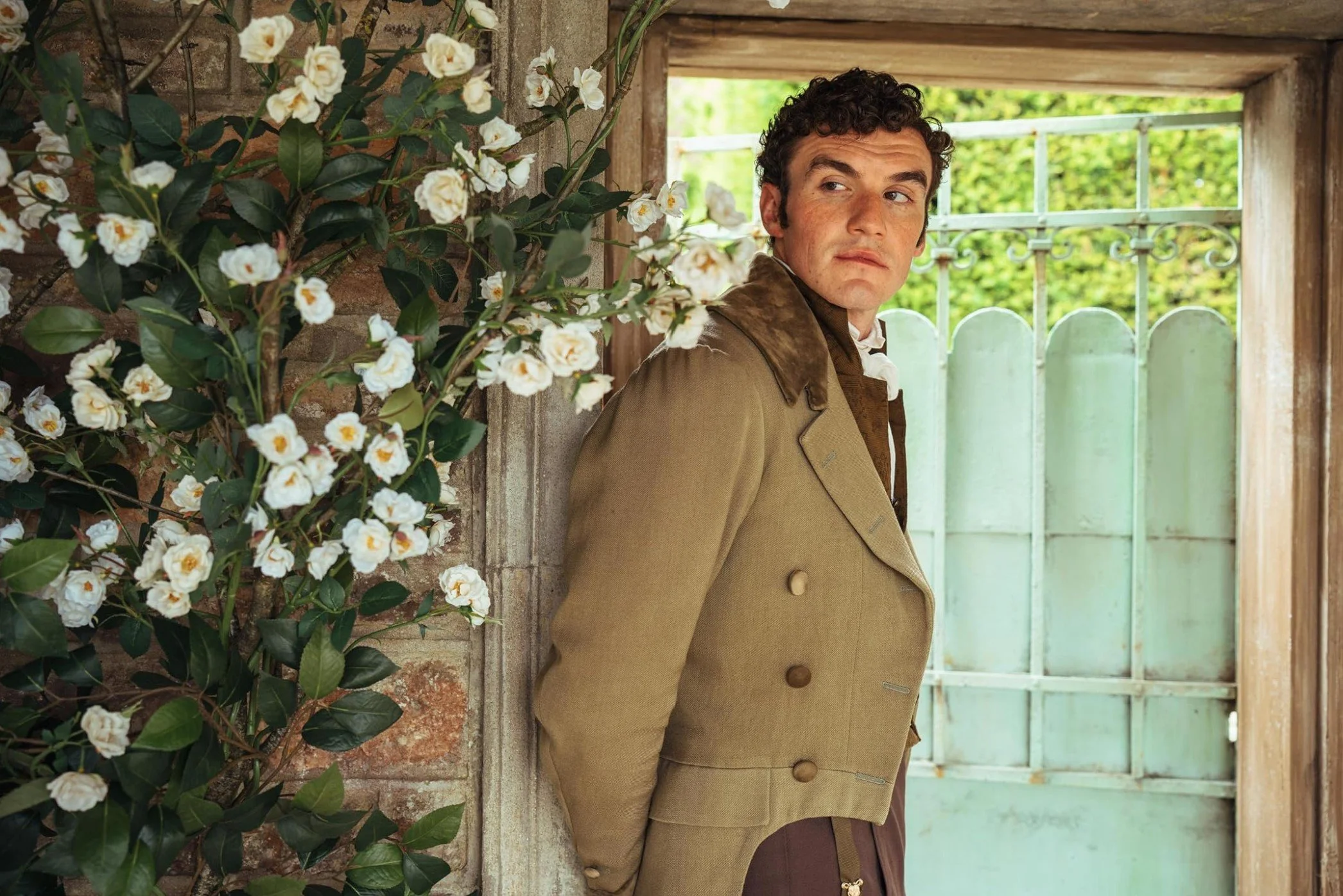 Donal Finn standing in the doorway to a garden in The Other Bennet Sister
