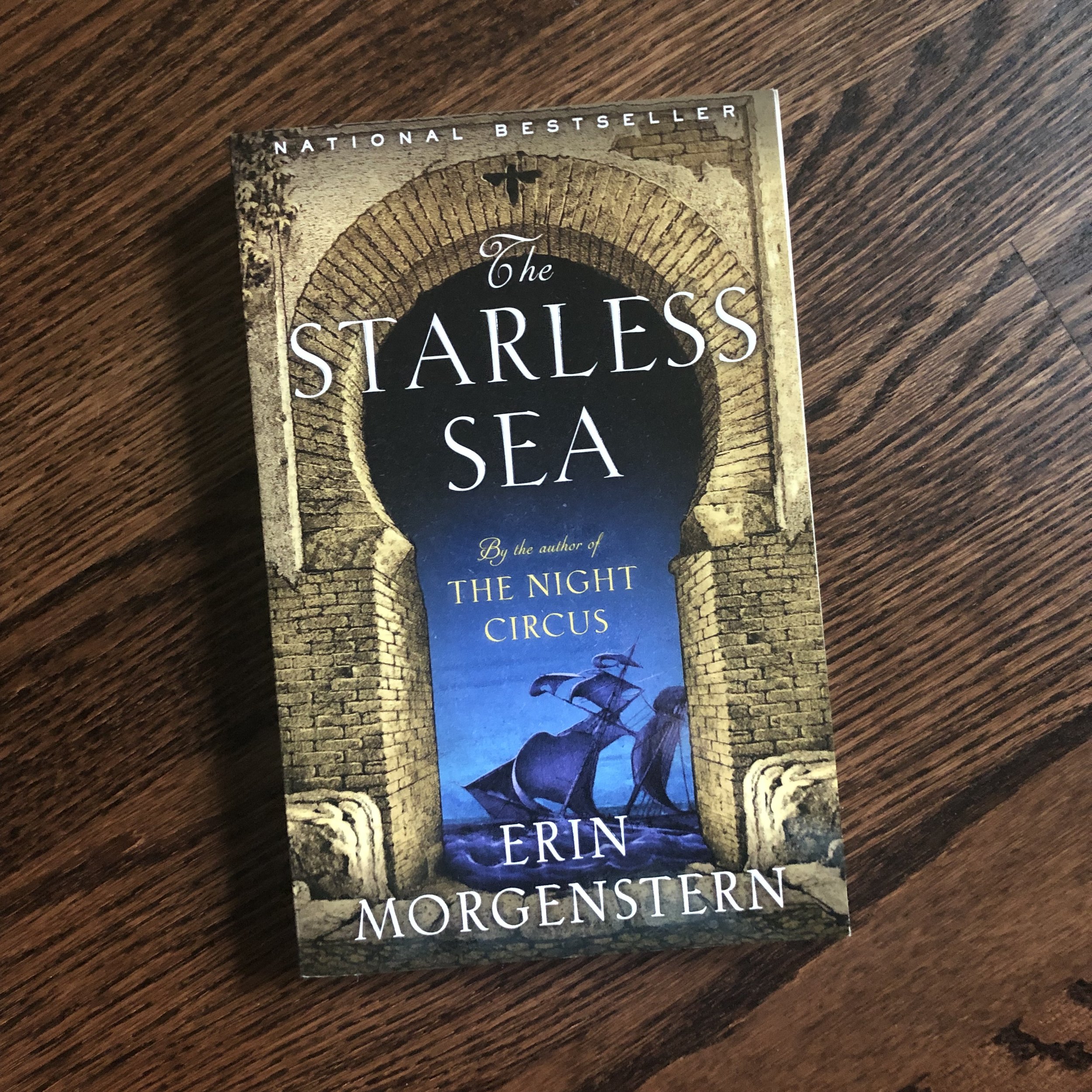 The Starless Sea book on a wood background