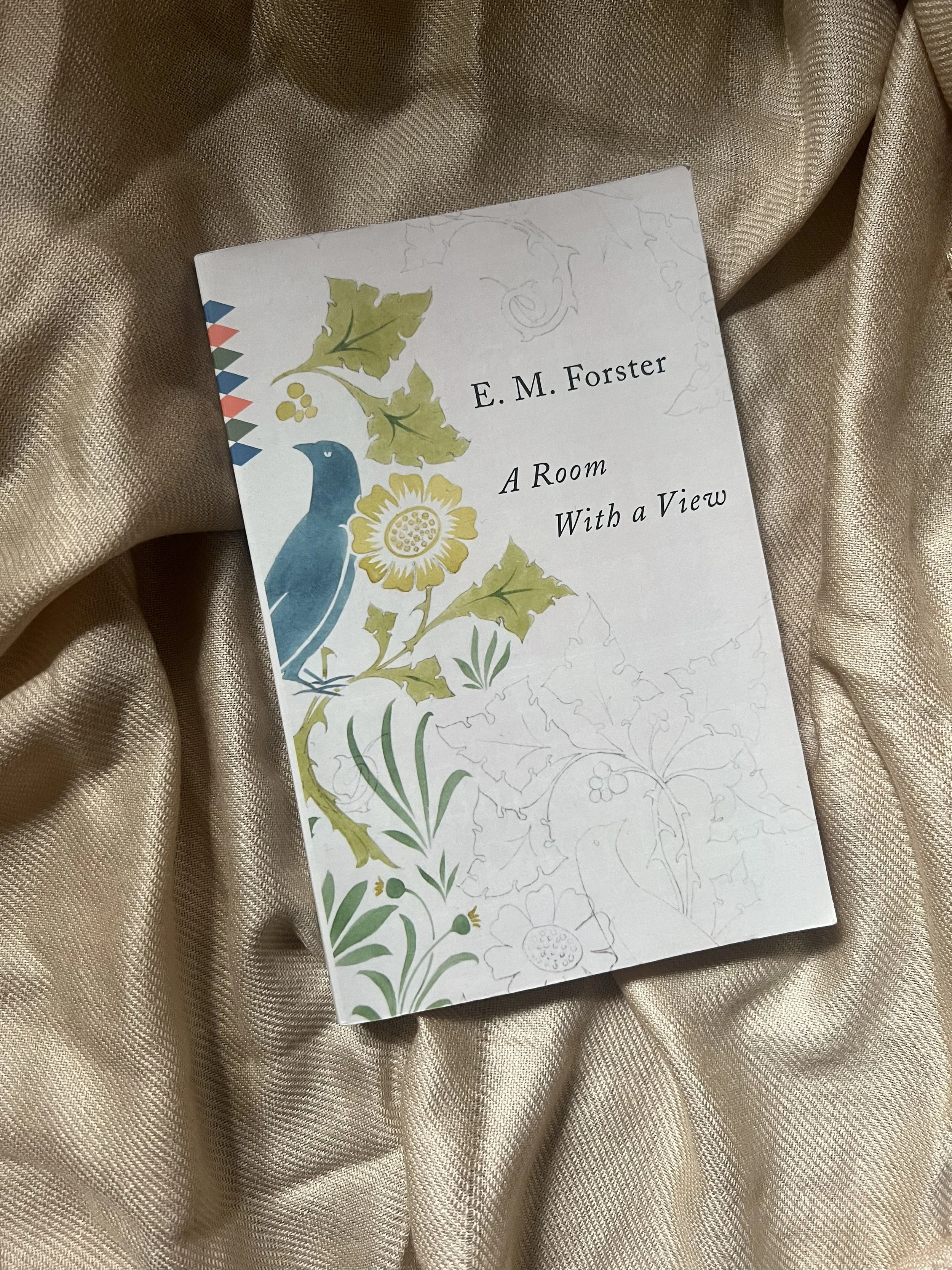 book cover of E. M. Forster's A Room with a View with a blue bird and flowers