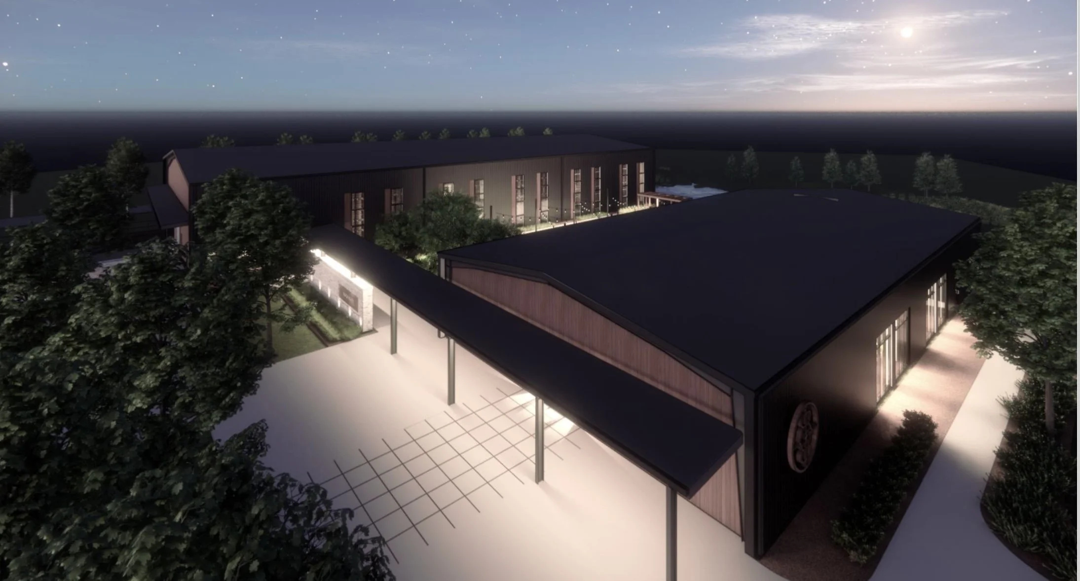 Nighttime view of a modern building with large windows, surrounded by trees, and lit pathway, under a starry sky with a bright moon.