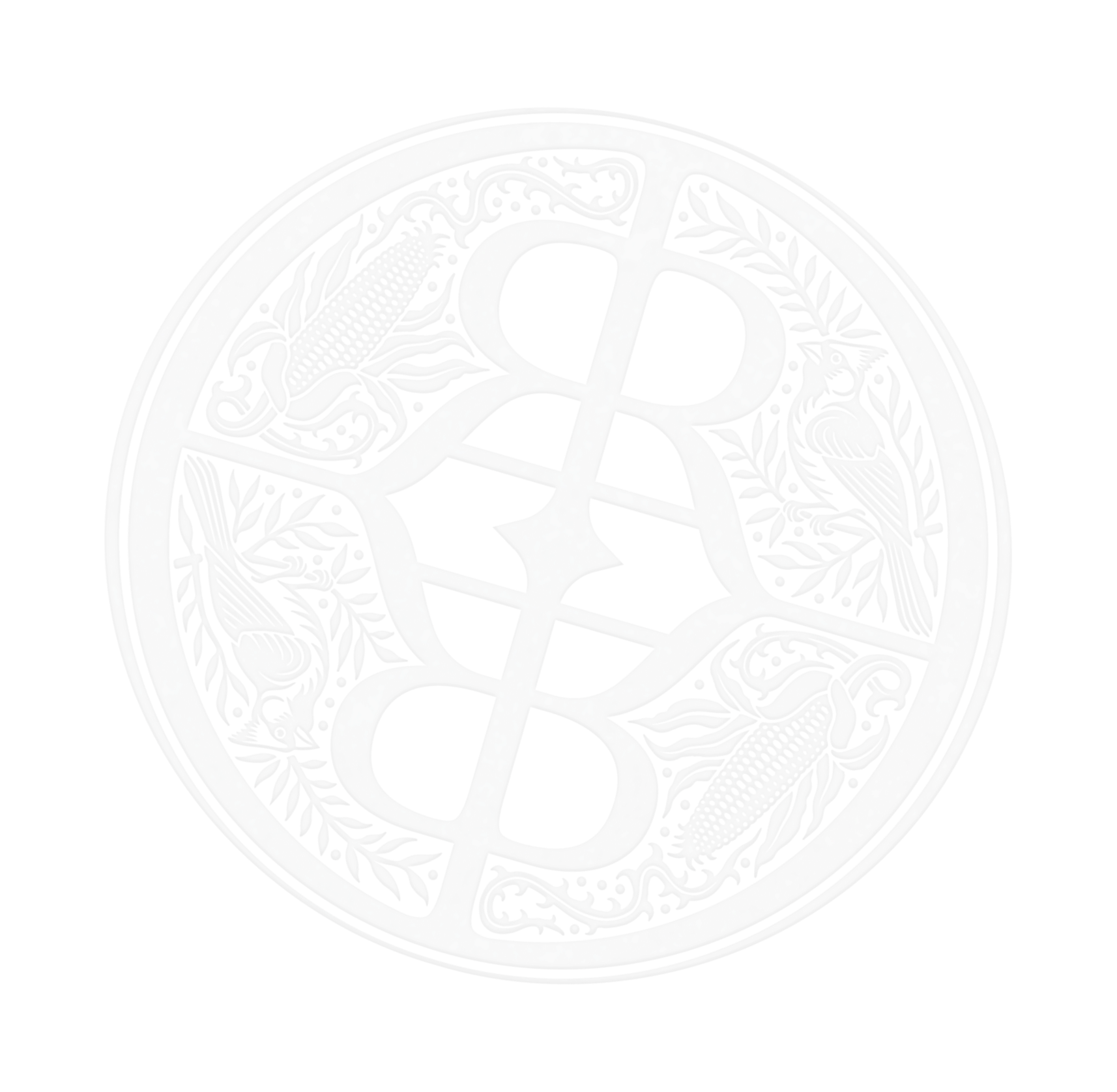 Close-up of a circular metallic emblem with intricate patterns, including corn cobs, leaves, and various decorative elements arranged in a symmetrical design.