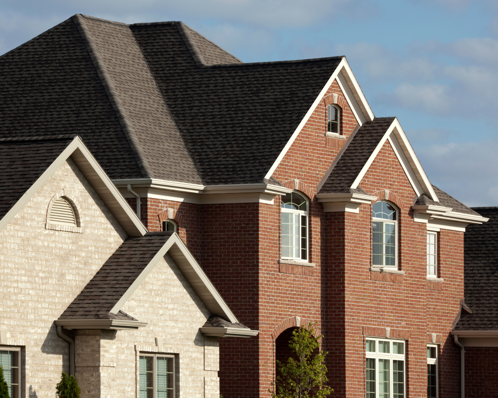 Roof Shingles on a Red Brick House