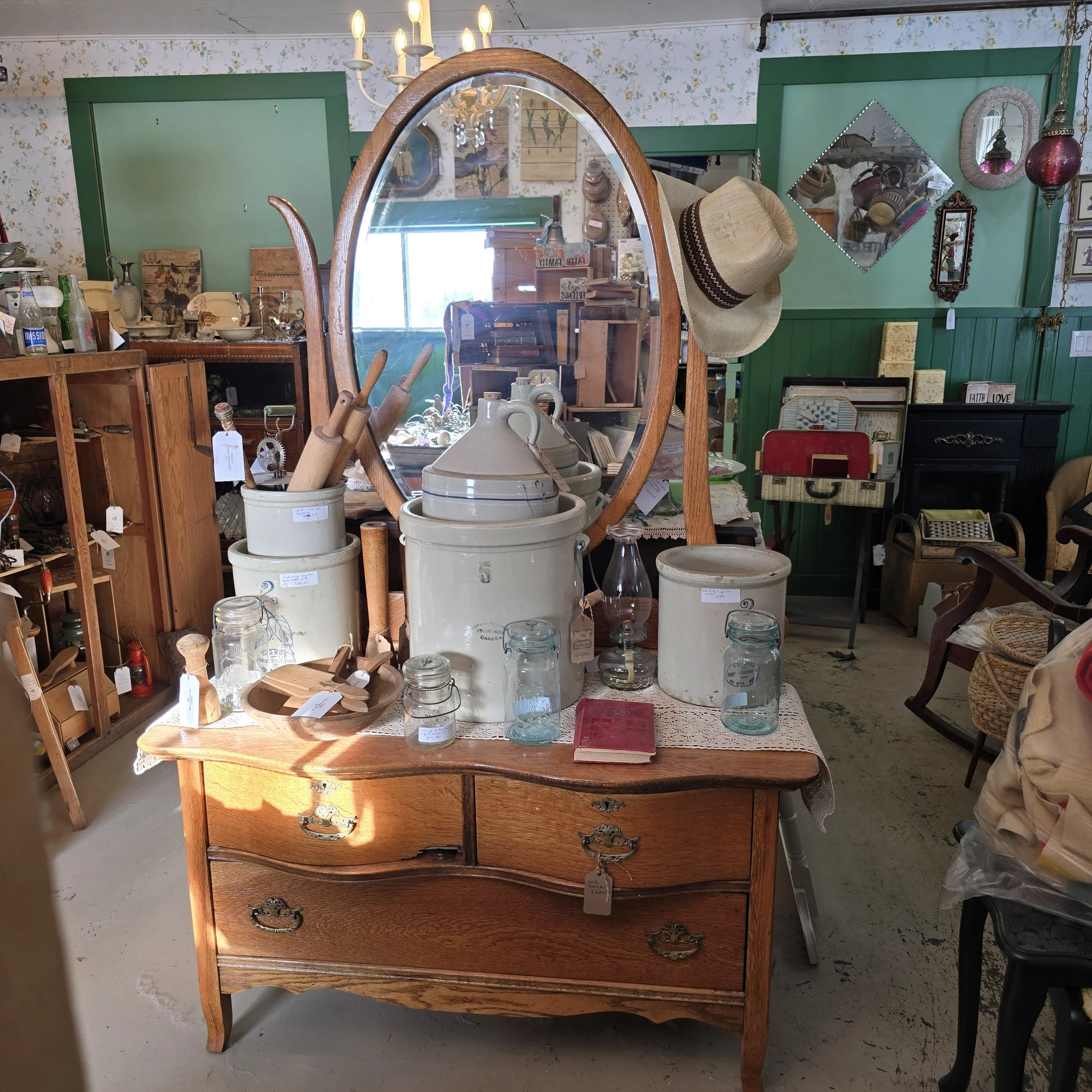 oak dresser with large oval mirror.  Small chip wood to bottom of left top drawer.  $240
