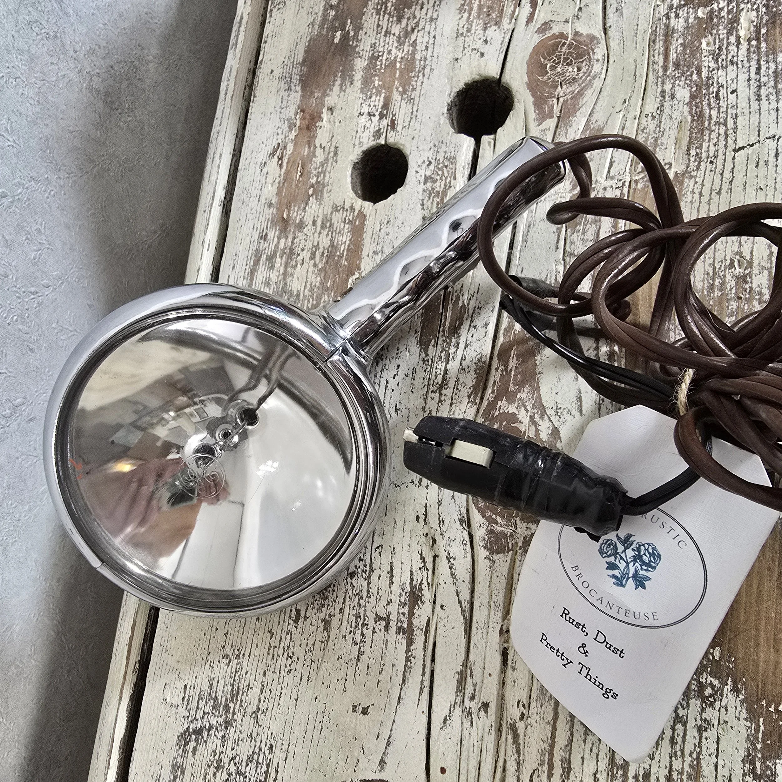 Handheld automotive spot light, plugs into a cigarette lighter.  $75